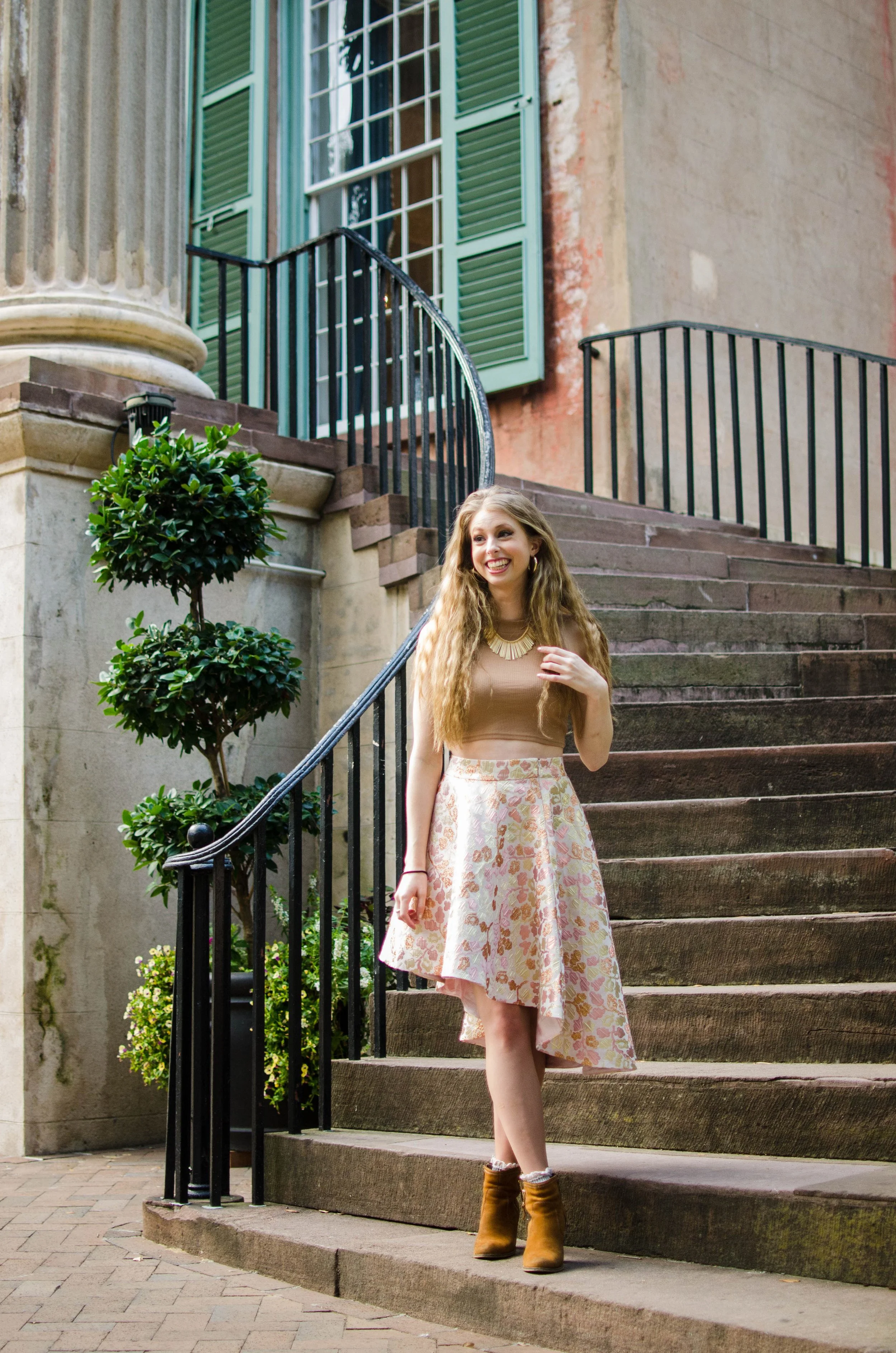 BT133-blonde-woman-on-stairs-smiling.jpg
