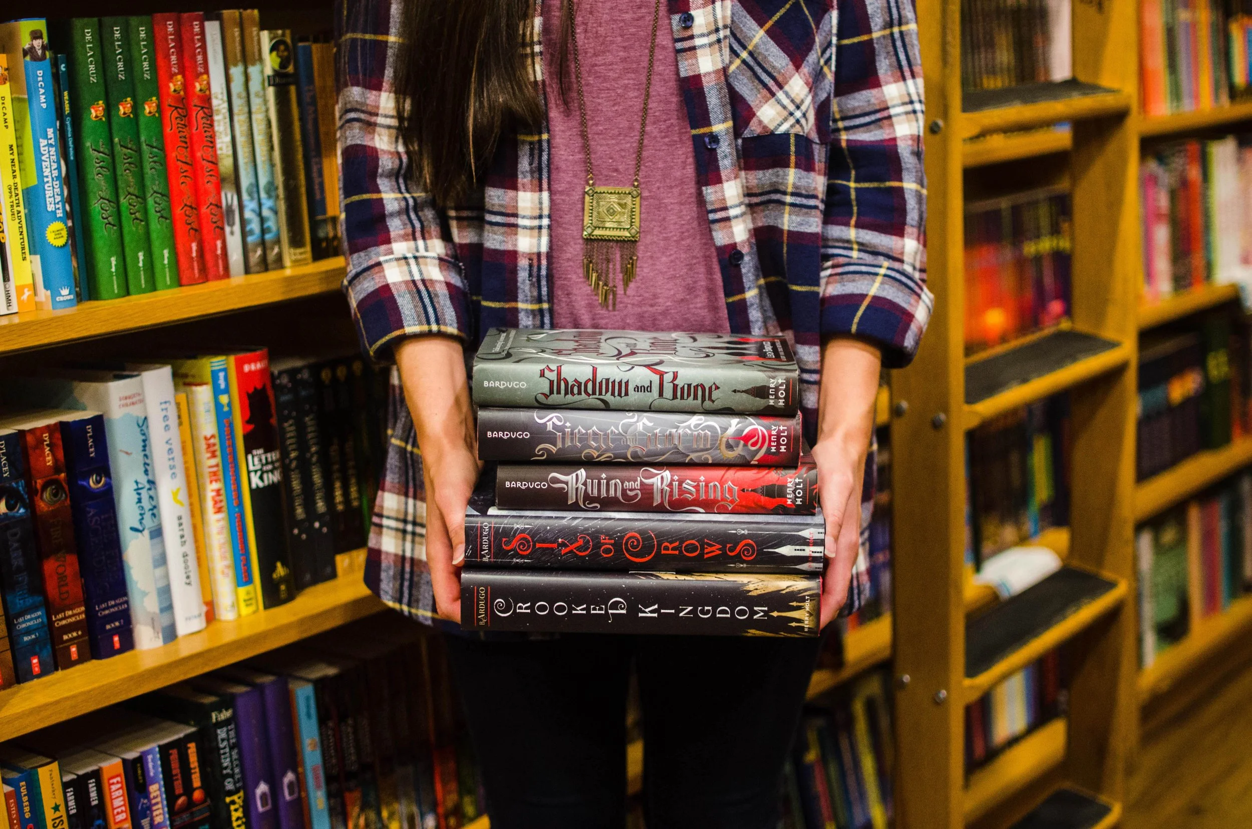 BT93-person-holding-leigh-bardugo-grisha-books.jpg
