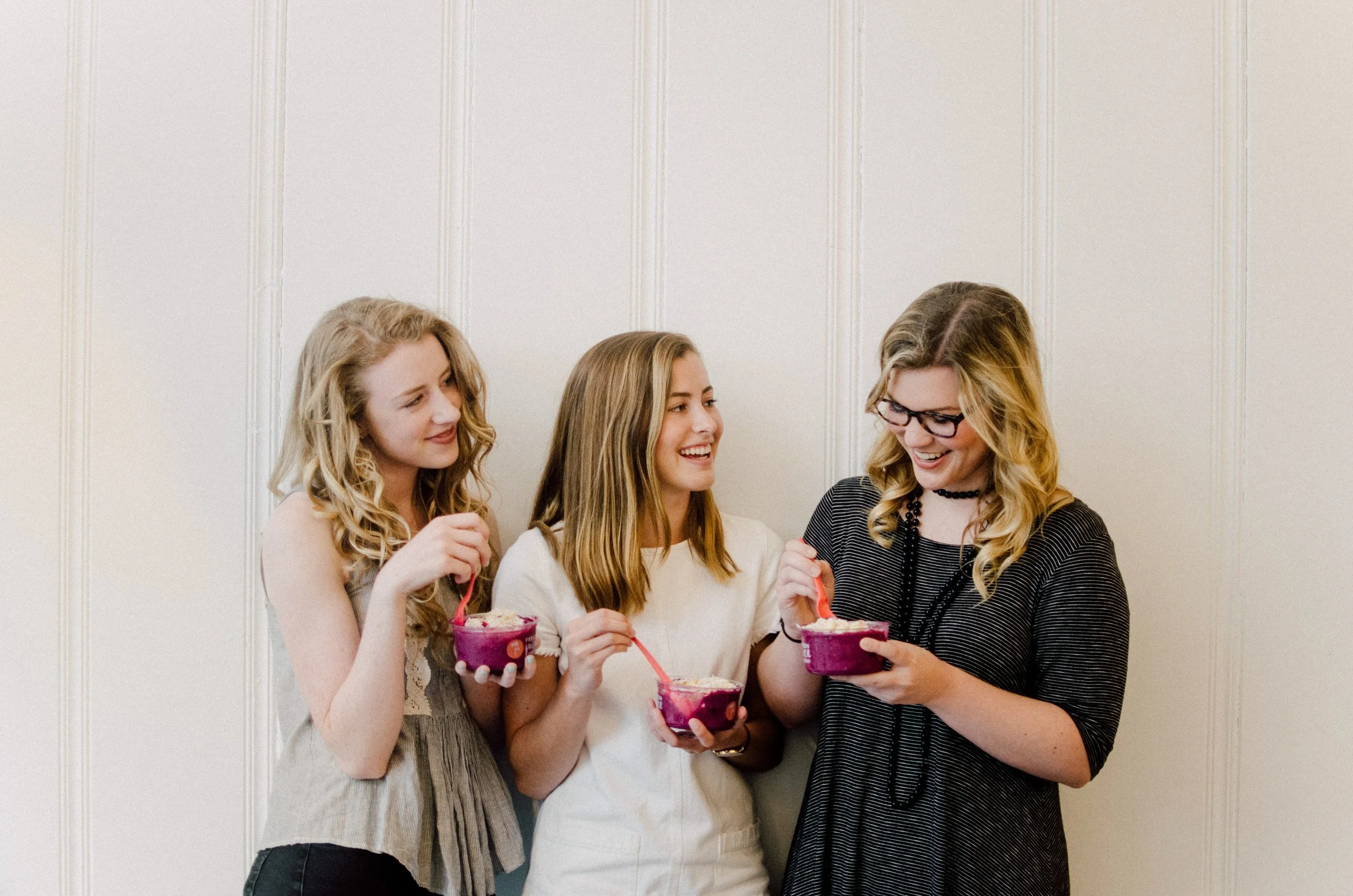 d188-women-eating-smoothie-bowls-standing.jpg