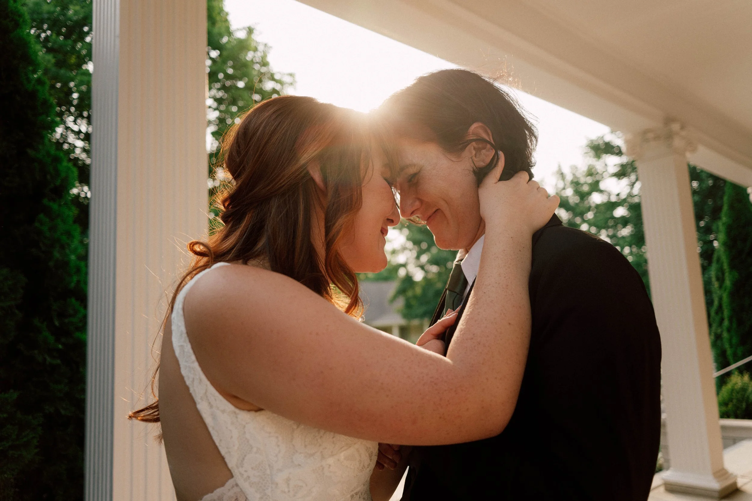 HRD41-brides-holding-each-other-sunset.jpg