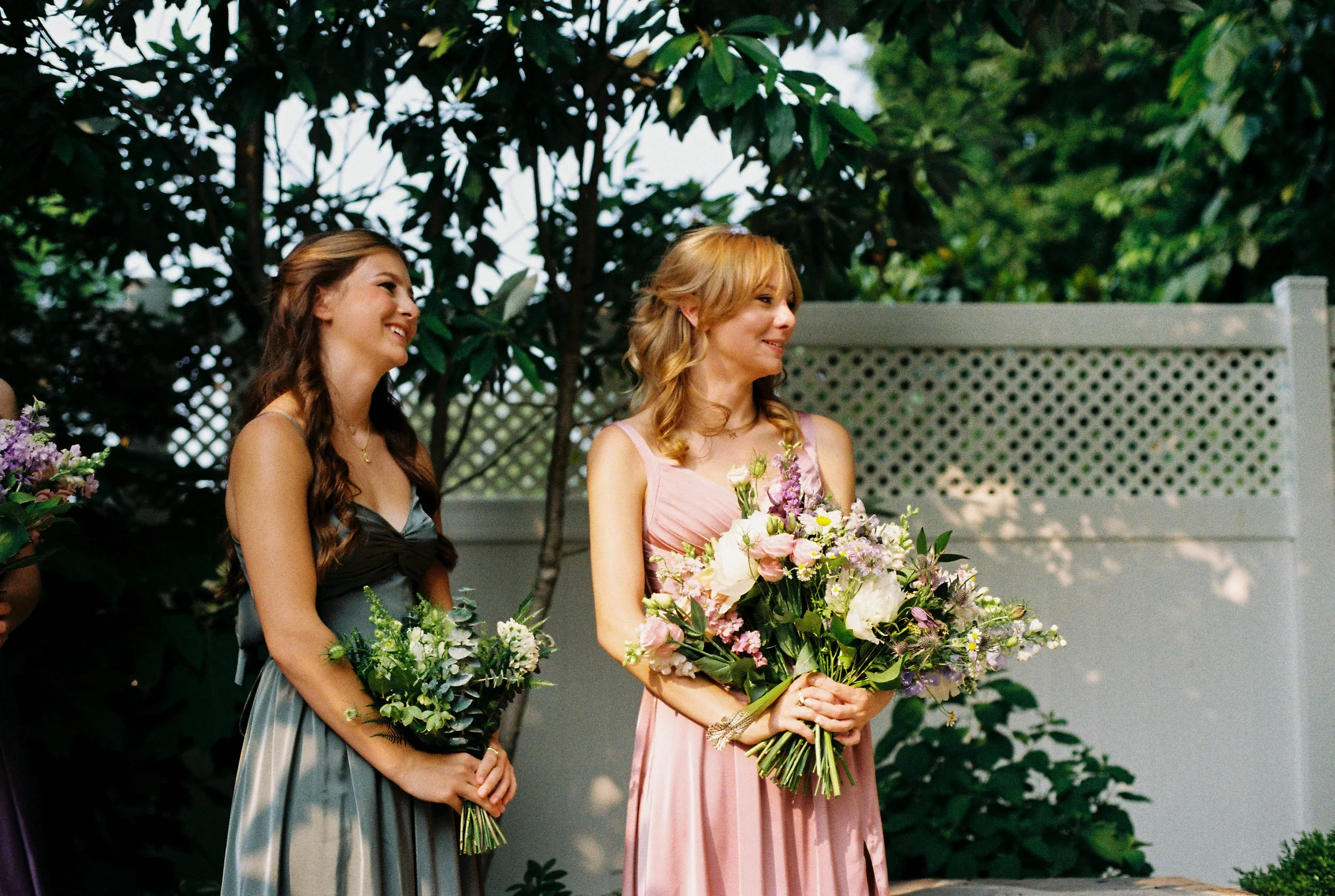 HRF41-bridesmaids-smiling-during-wedding-ceremony.jpg