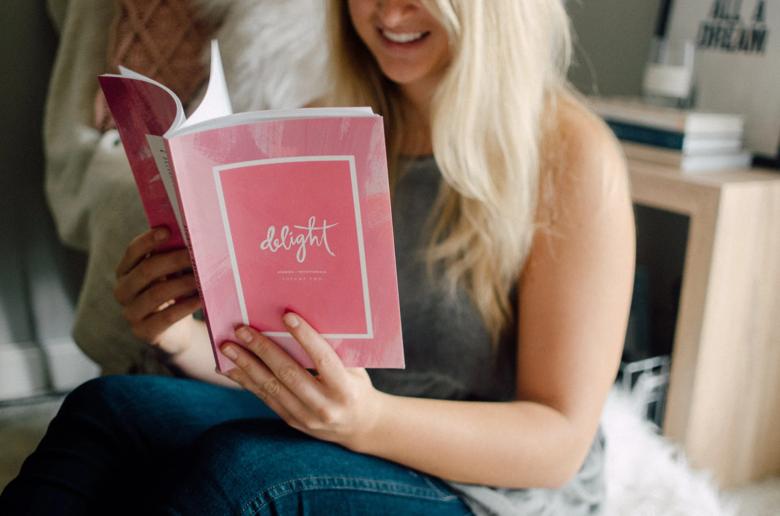 d173-woman-holding-reading-pink-delight-book.jpg