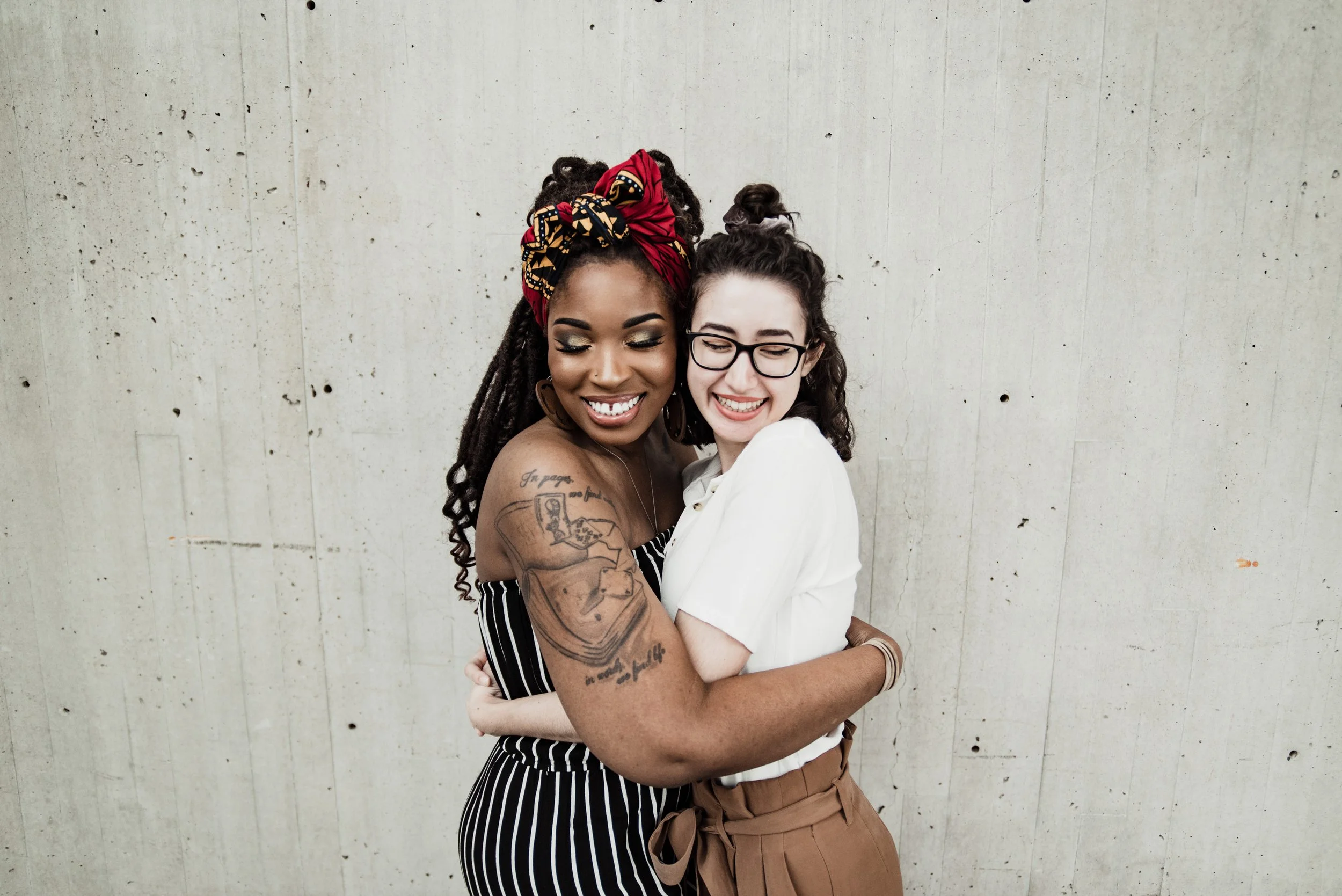 BT310-two-women-hugging-smiling.jpg