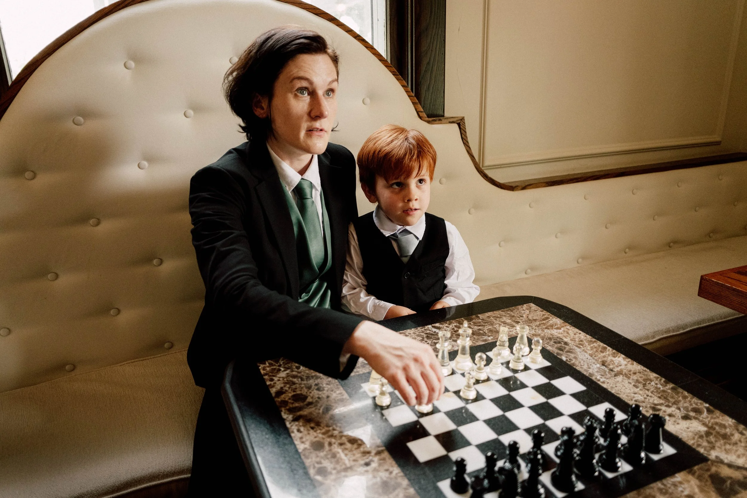 HRD13-woman-in-suit-playing-chess-with-kid.jpg
