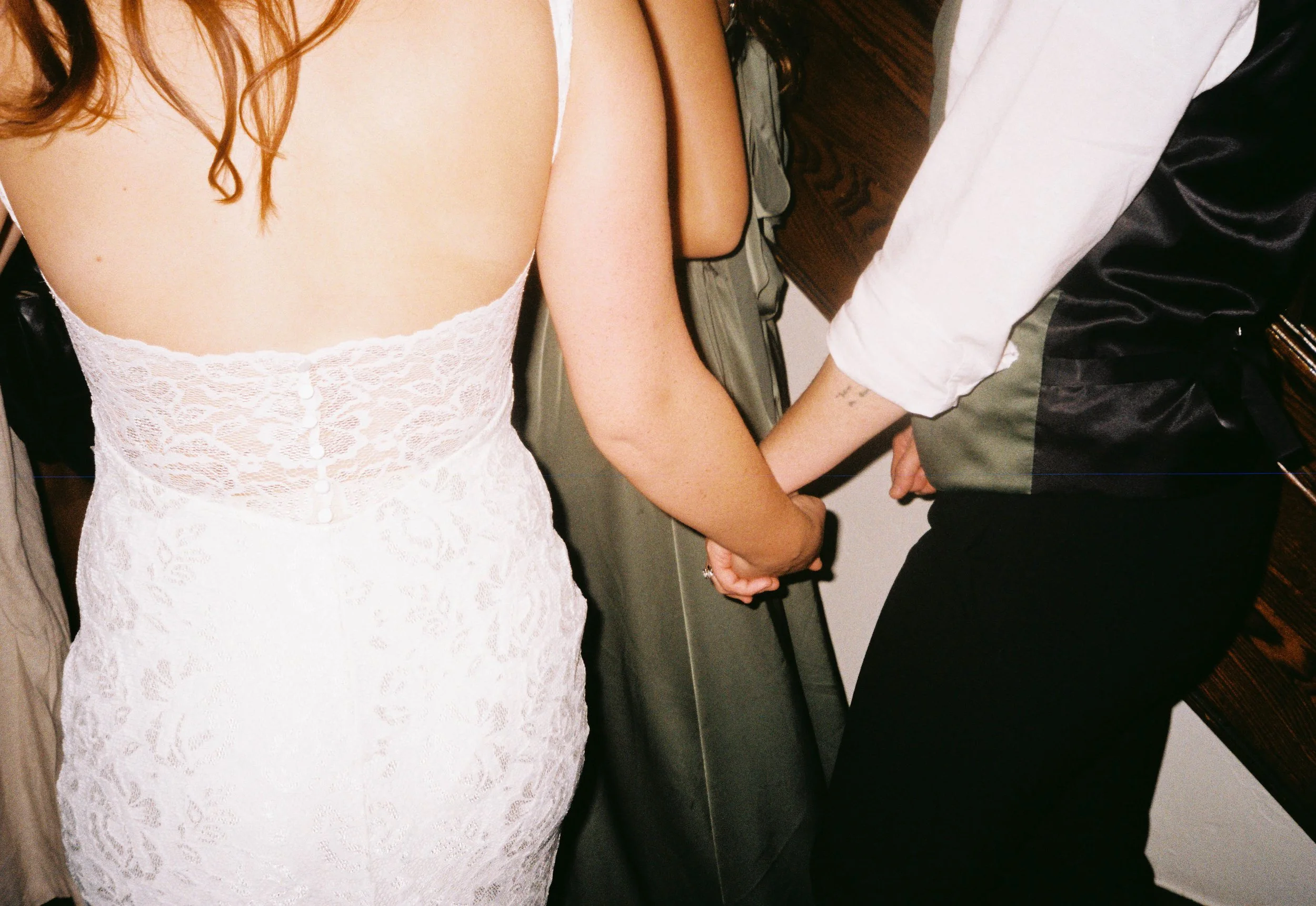 HRF68-lgbtq-brides-holding-hands-at-wedding.jpg