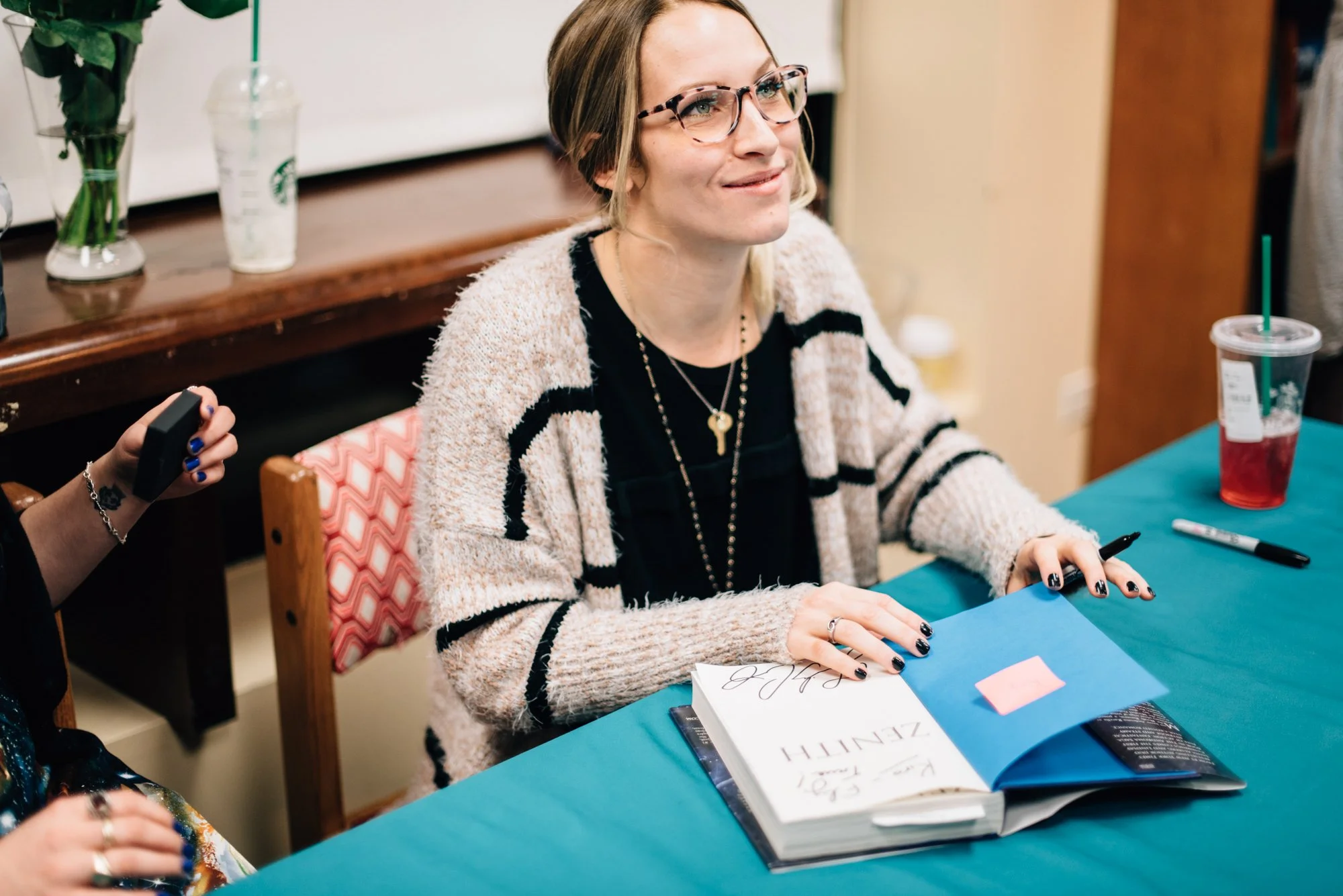 BT27-woman-smiling-with-book.jpg
