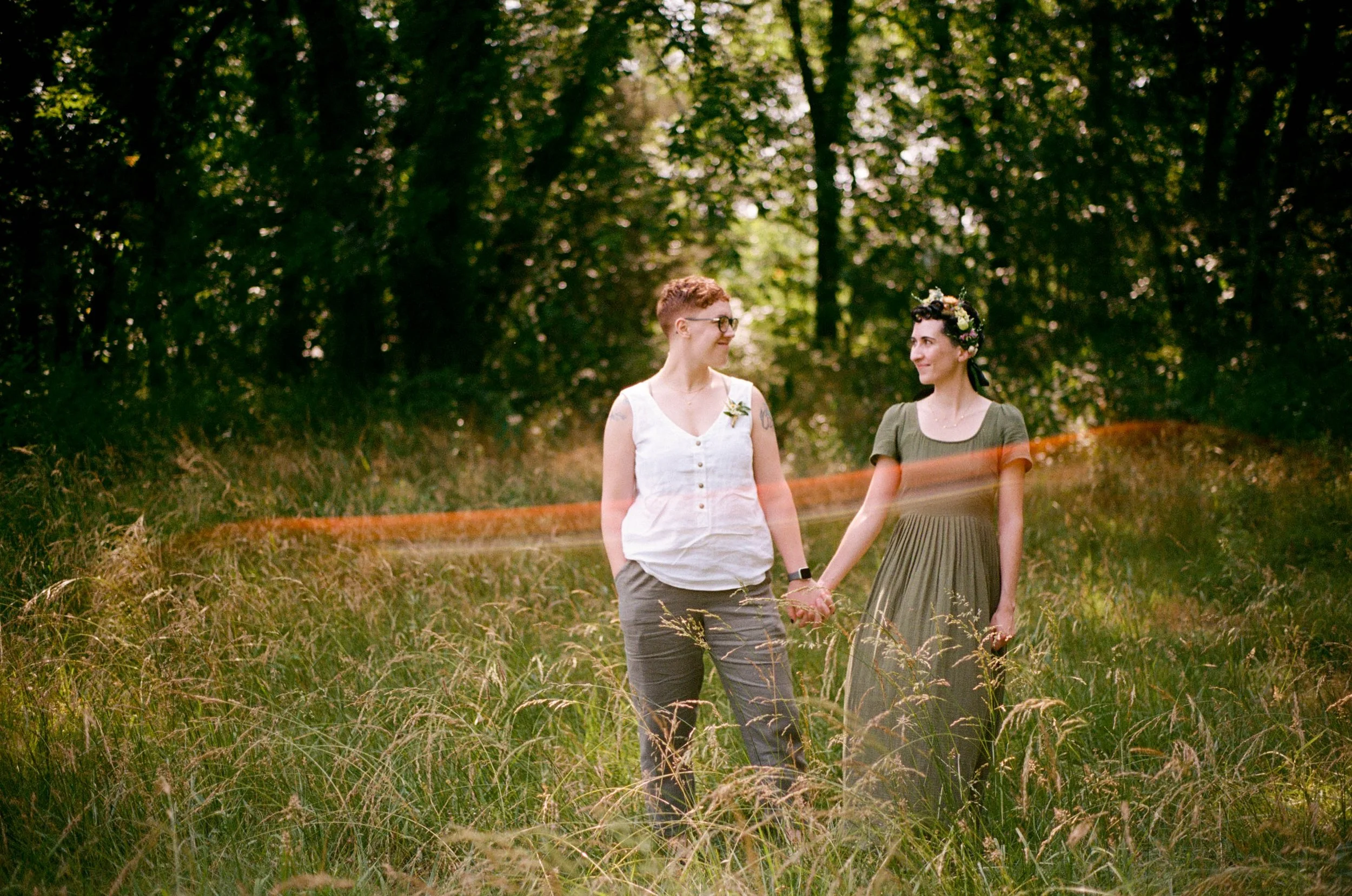 REW23-women-holding-hands-in-field.jpg