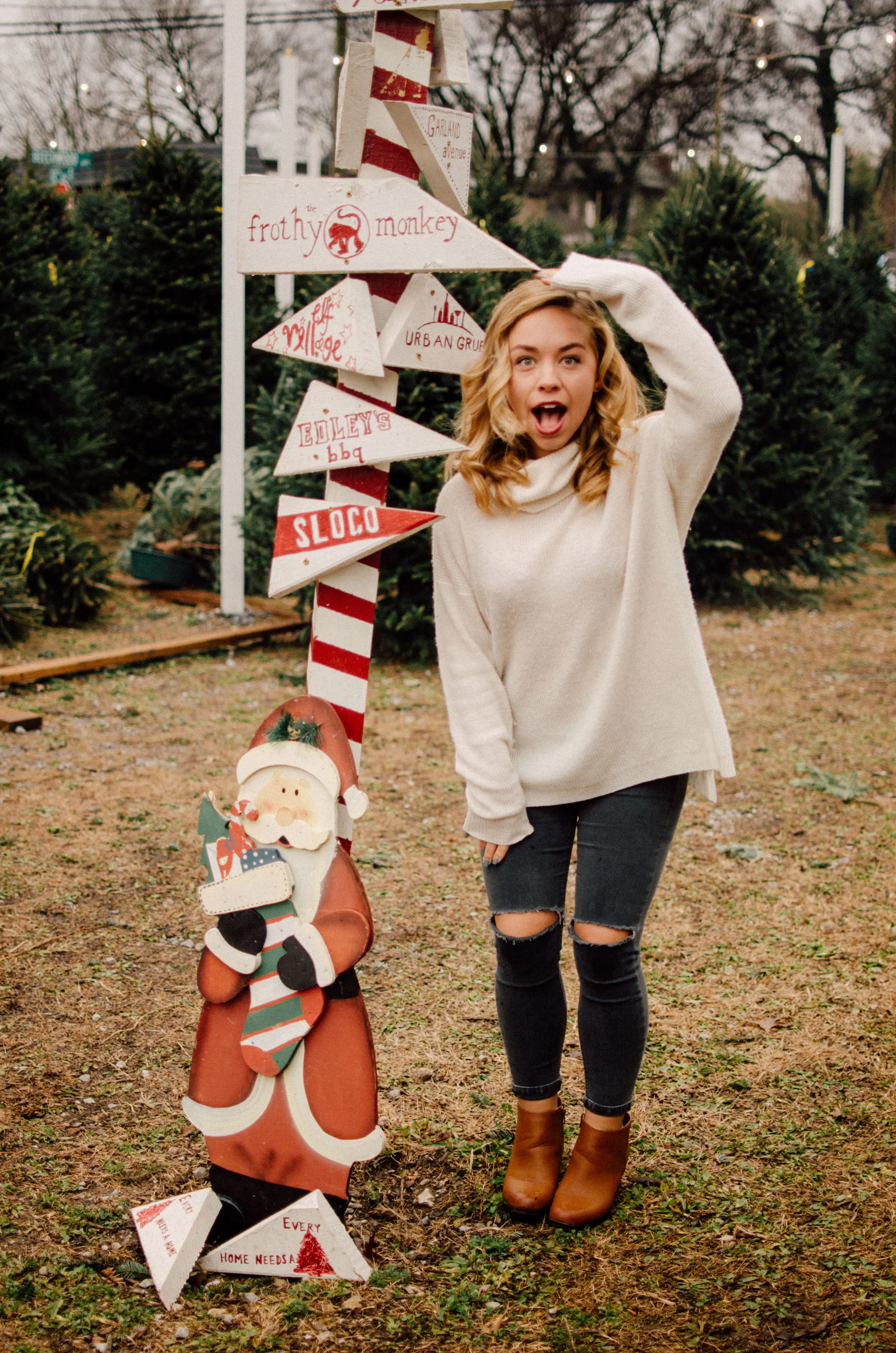 d37-college-girl-next-to-christmas-signs.jpg
