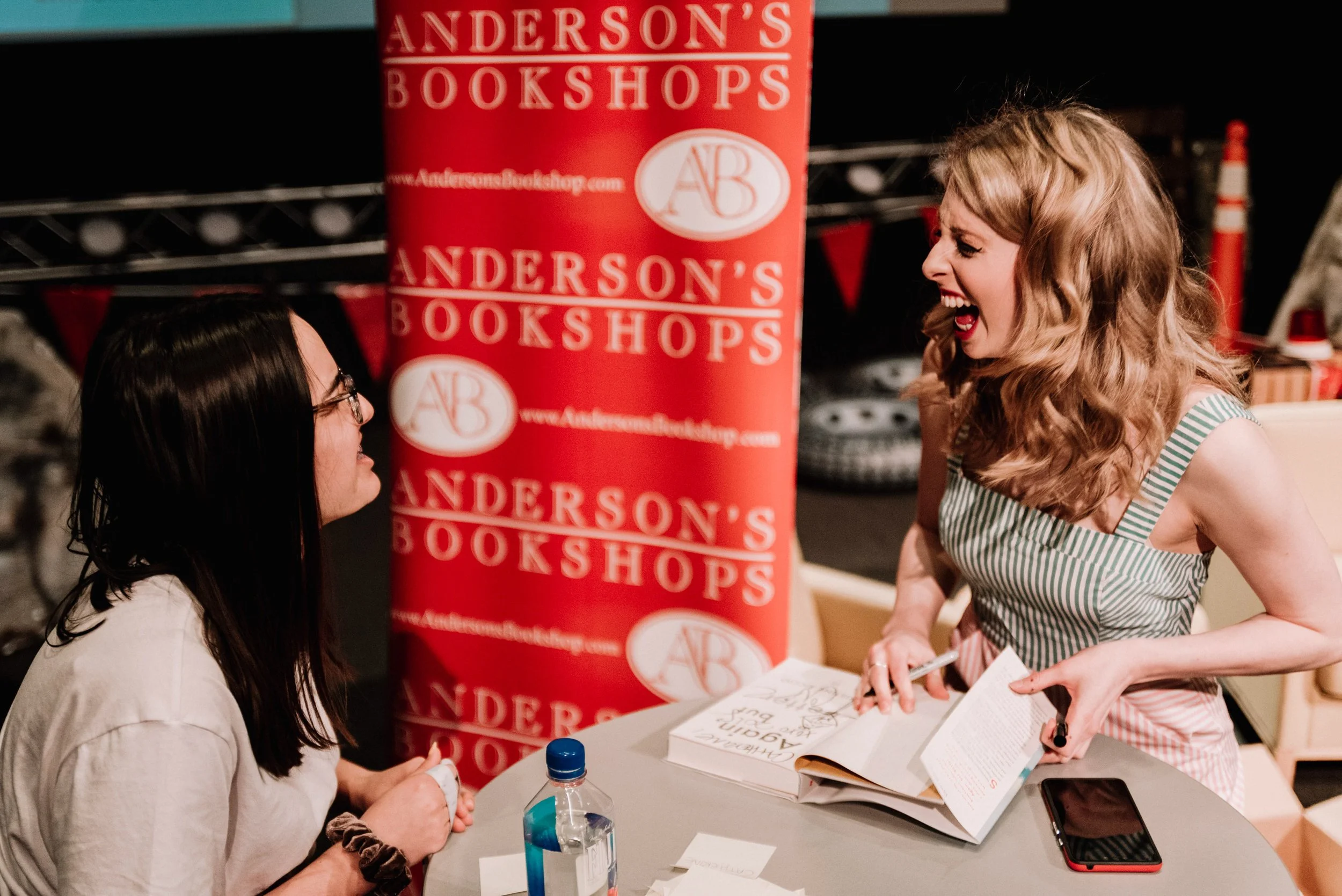 BT241-two-people-smiling-at-book-signing.jpg