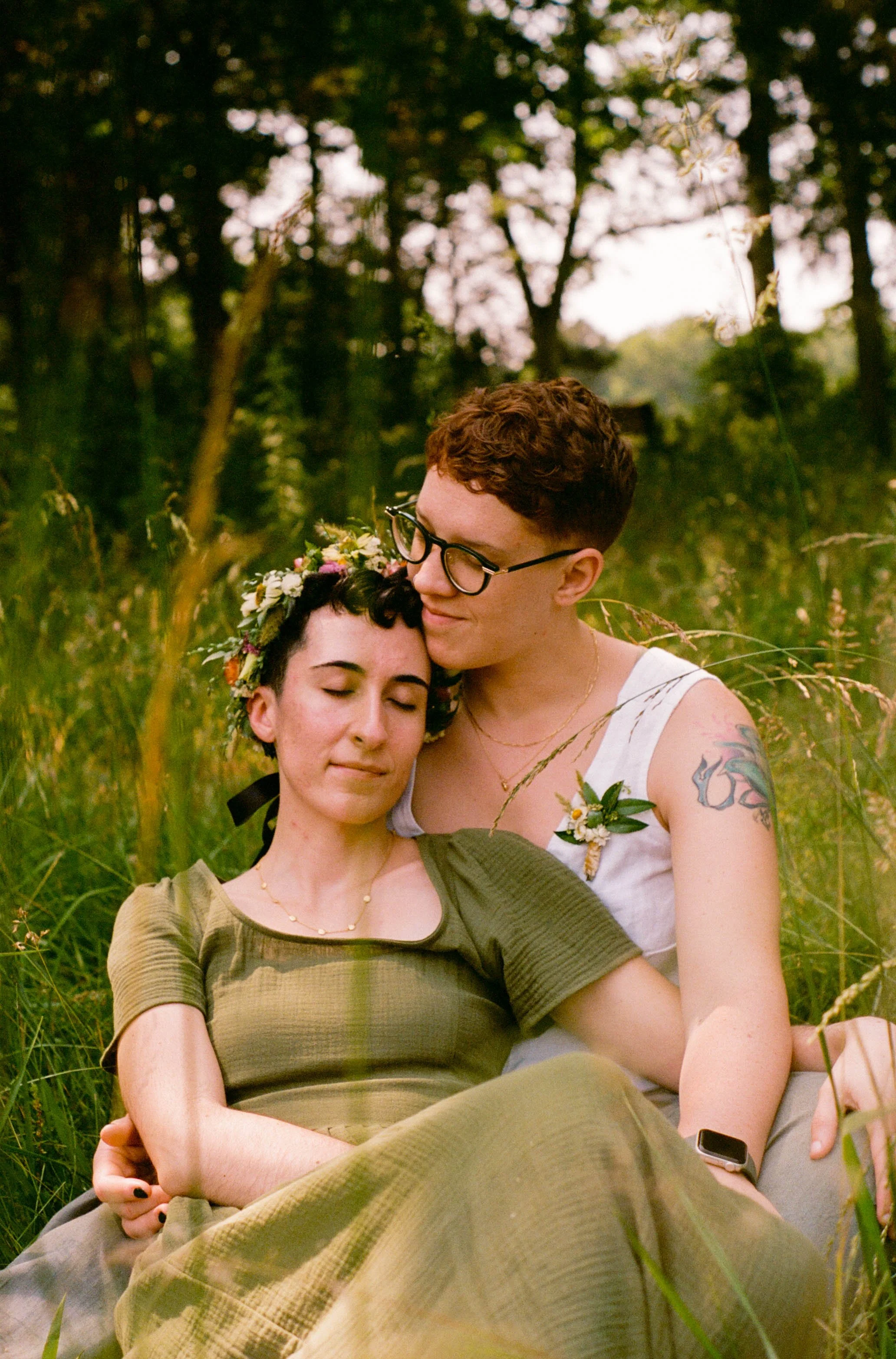 REW21-women-holding-each-other-in-field.jpg