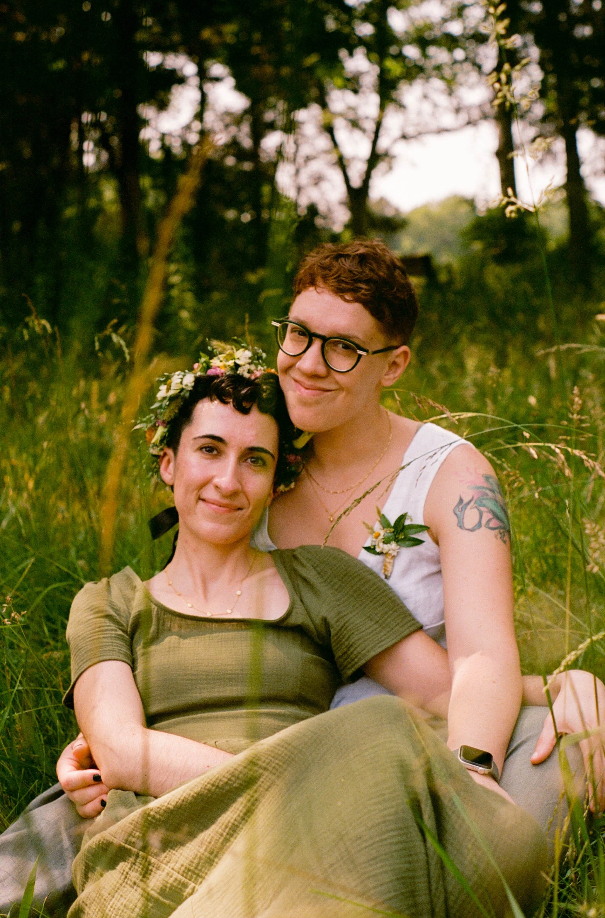 REW22-women-holding-each-other-in-field-smiling.jpg