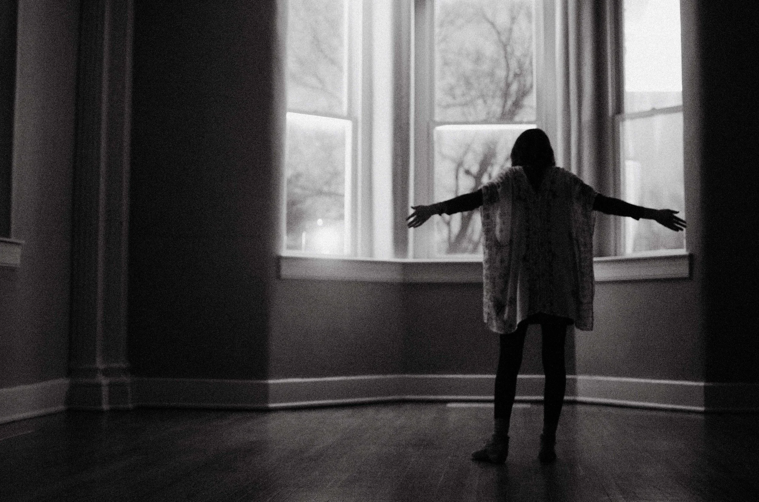 d64-woman-in-dark-worshipping-window.jpg