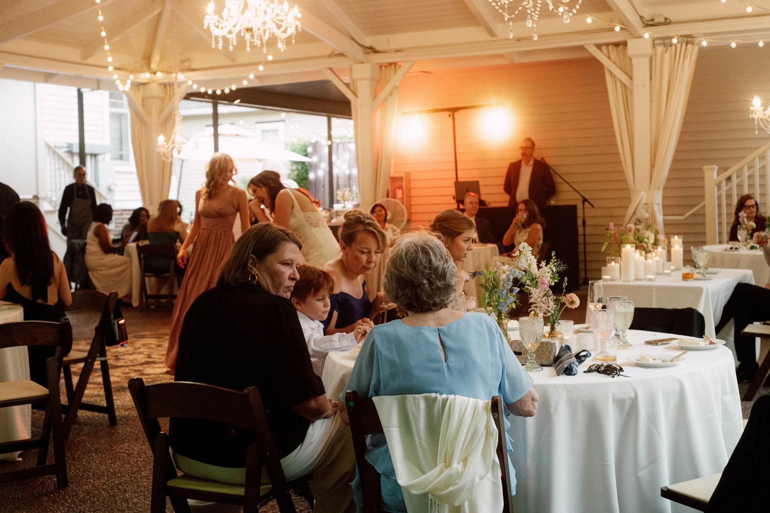 HRD62-guests-sitting-at-tables-during-wedding-reception.jpg