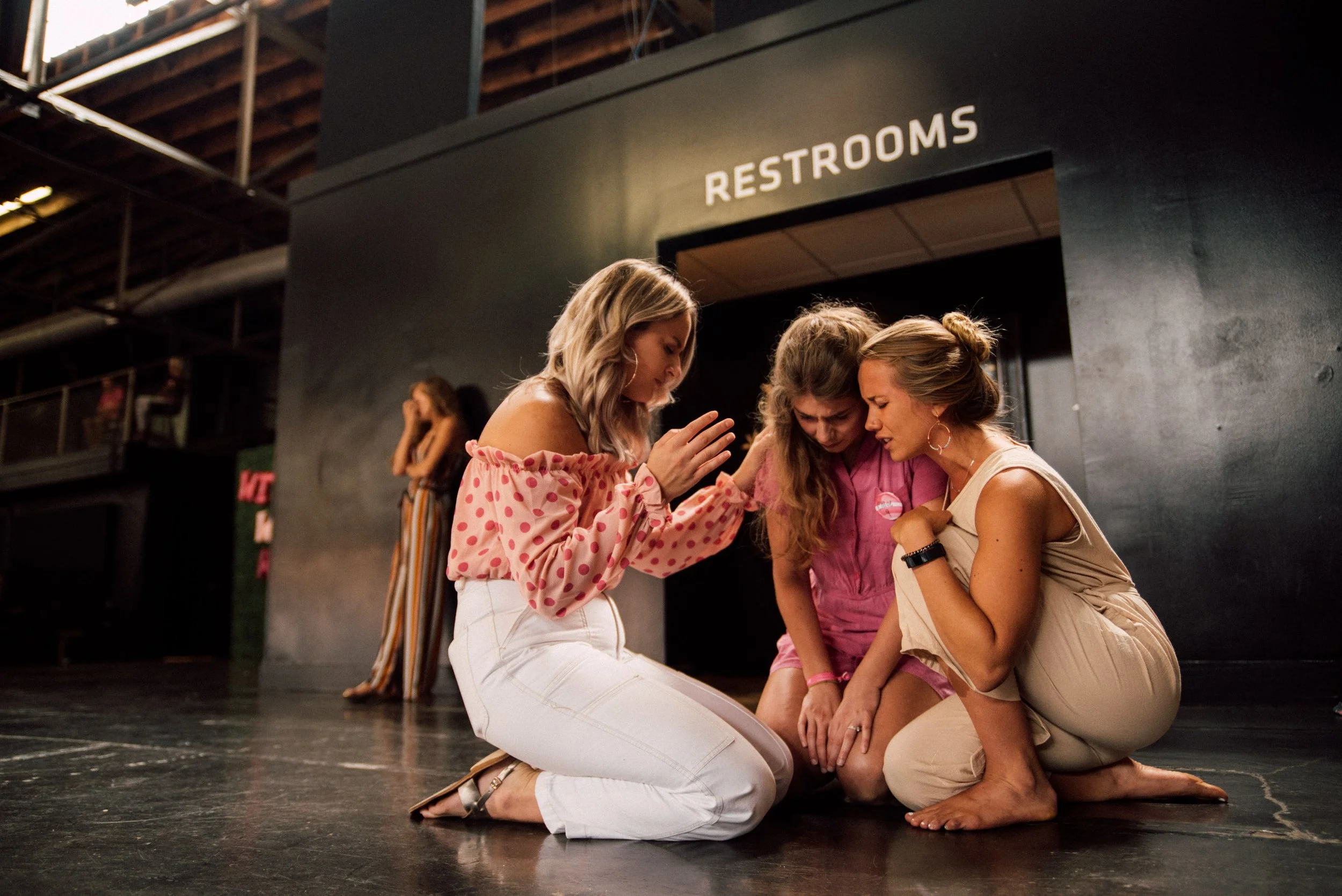 d293-women-praying-over-each-other.jpg