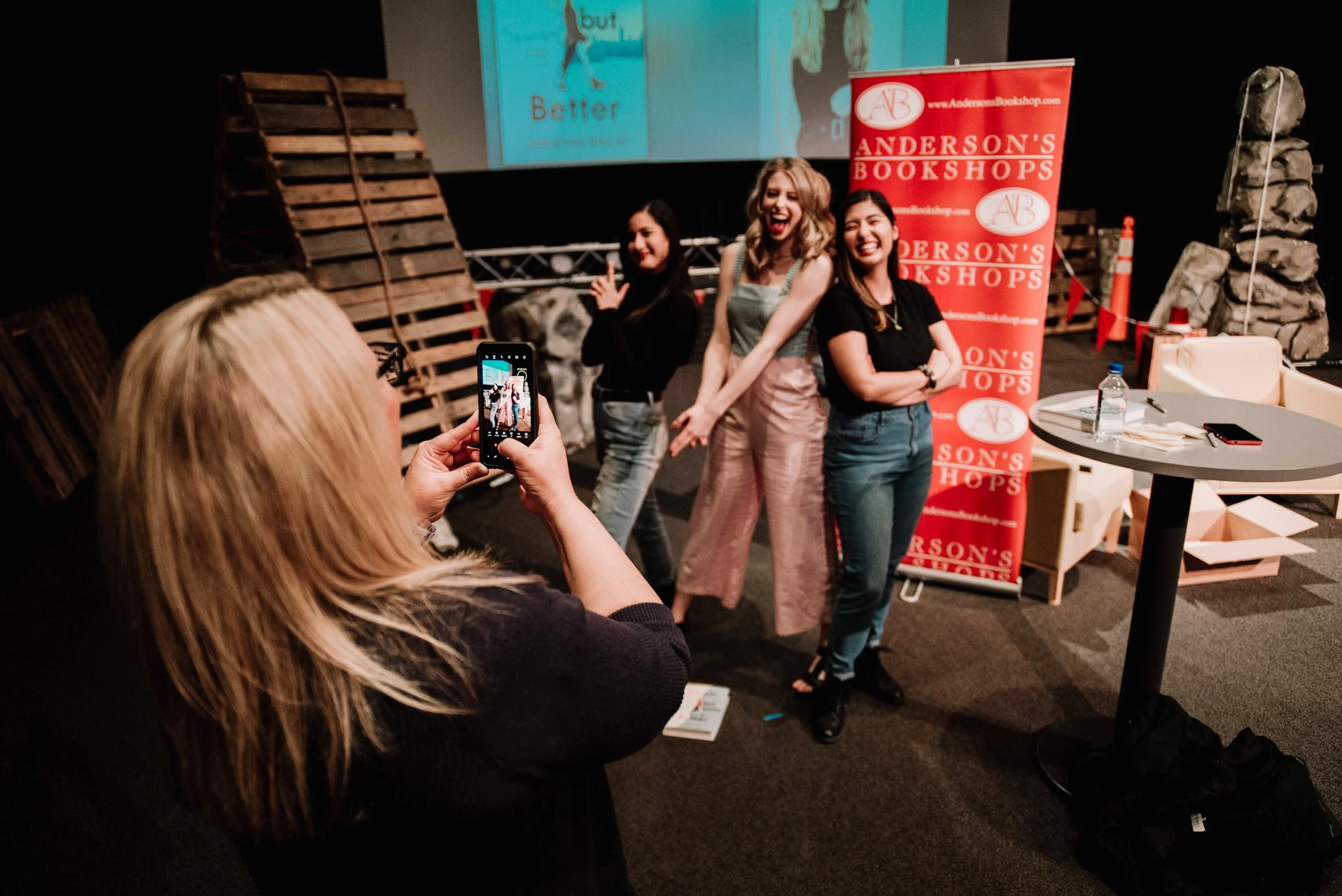 BT238-woman-taking-phone-photo-at-signing.jpg