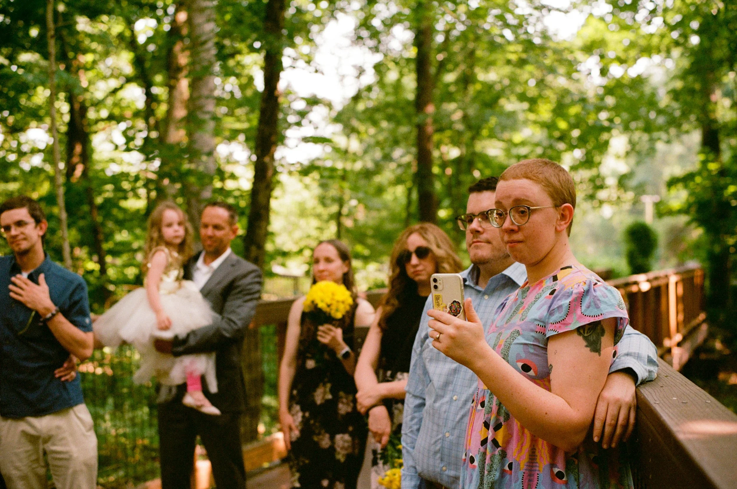 REW53-wedding-guests-woman-filming-on-iphone.jpg
