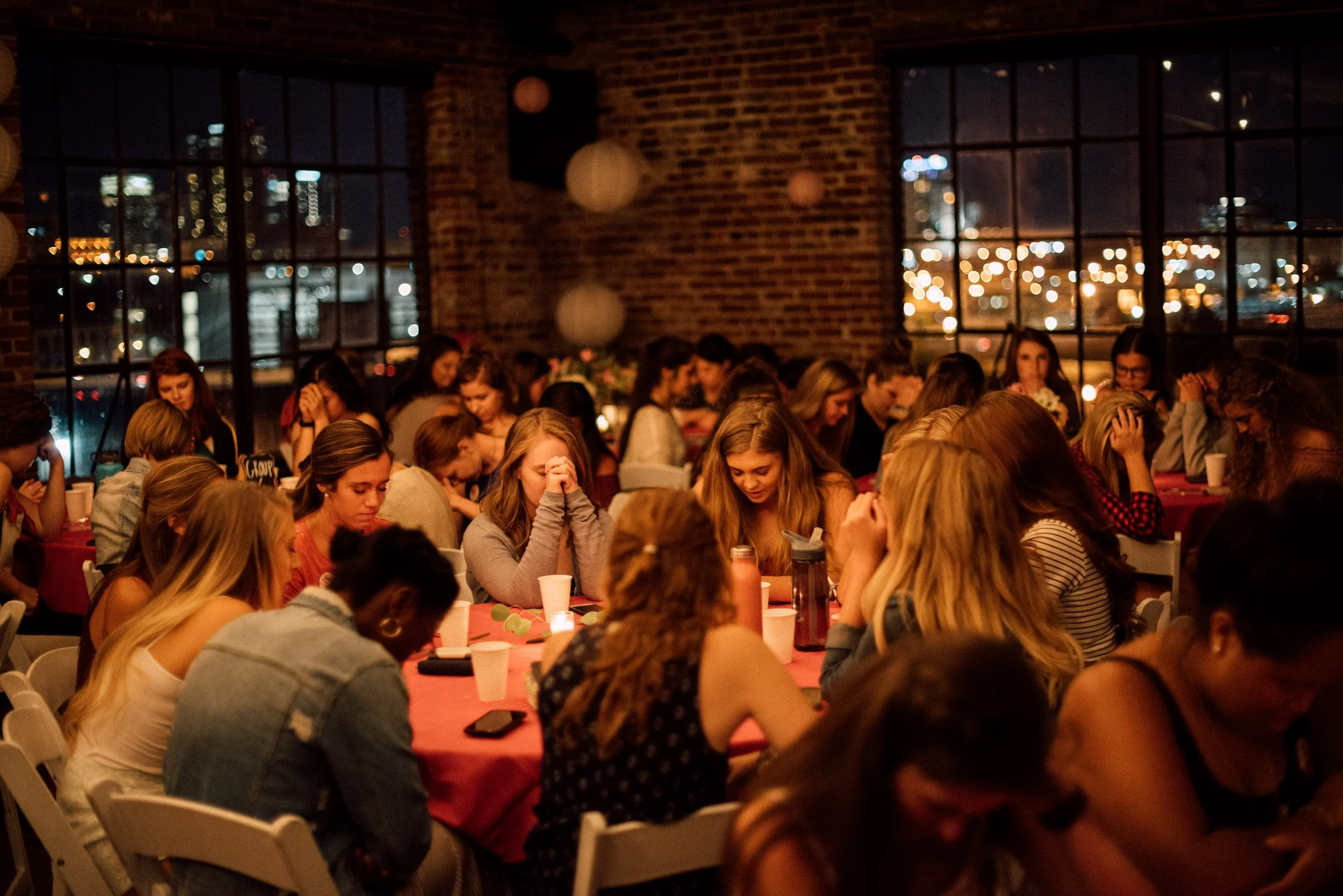 d219-women-at-tables-night-praying.jpg