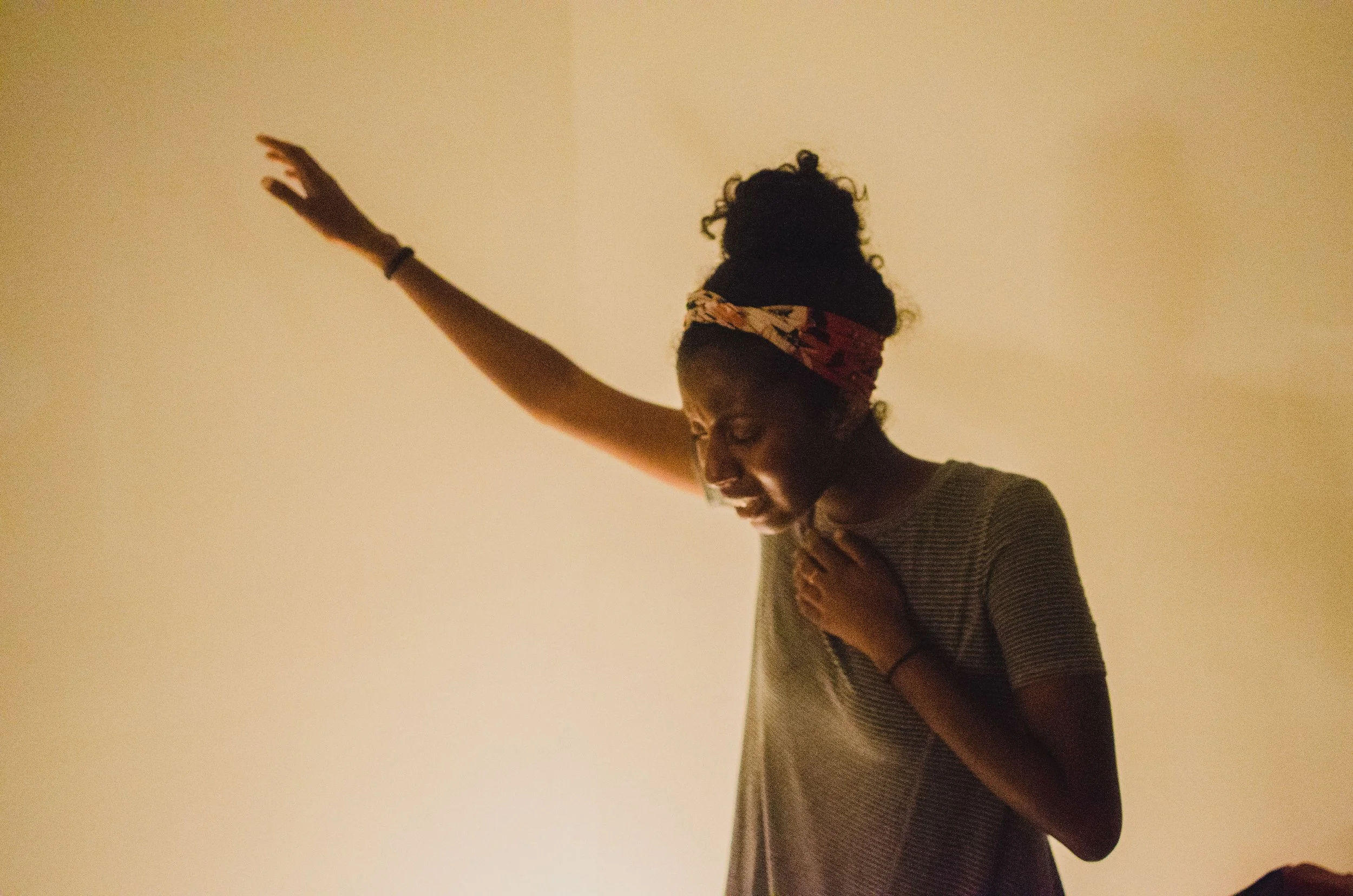 d126-black-woman-arm-up-worship.jpg