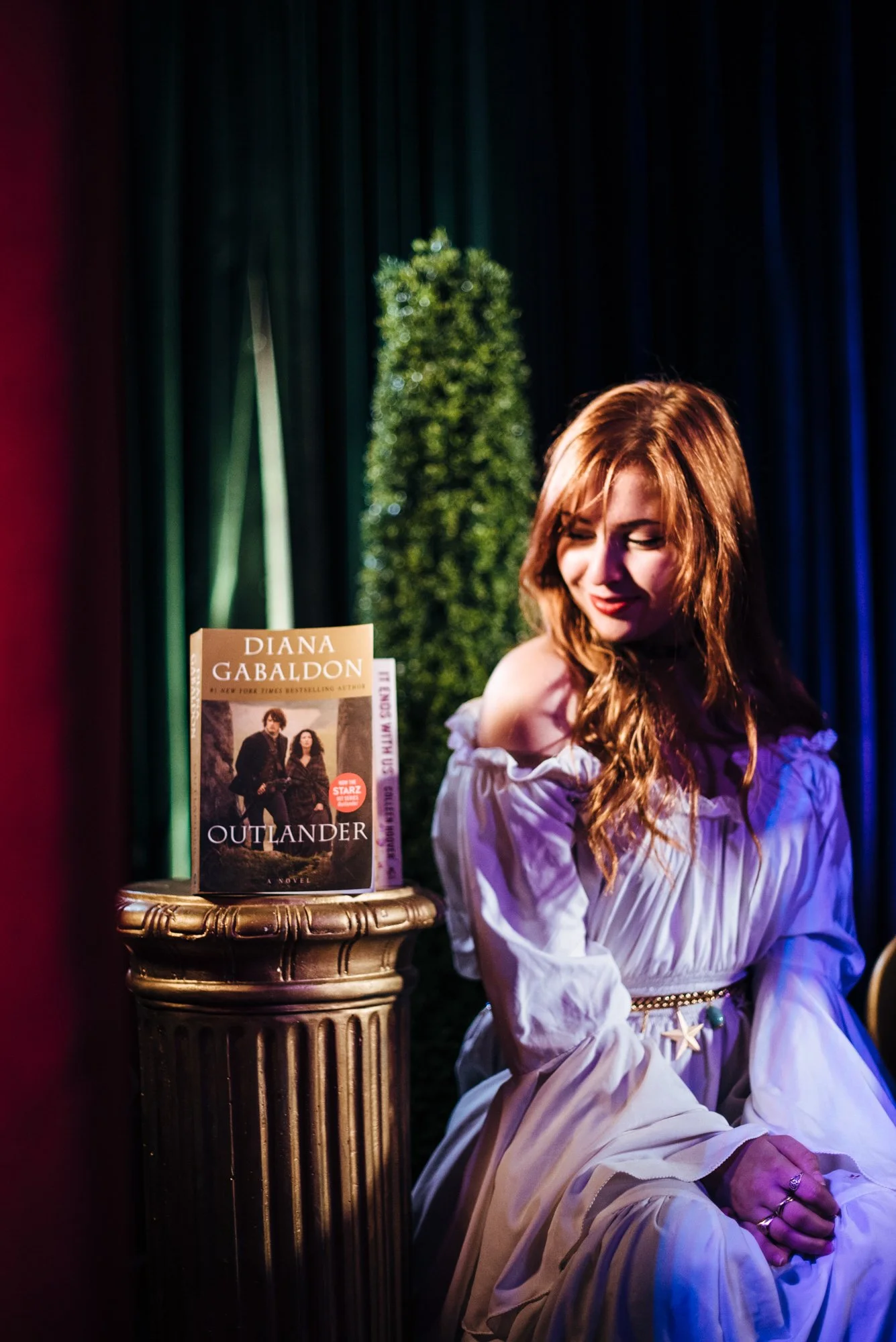 BT186-sasha-alsberg-looking-at-outlander-book.jpg