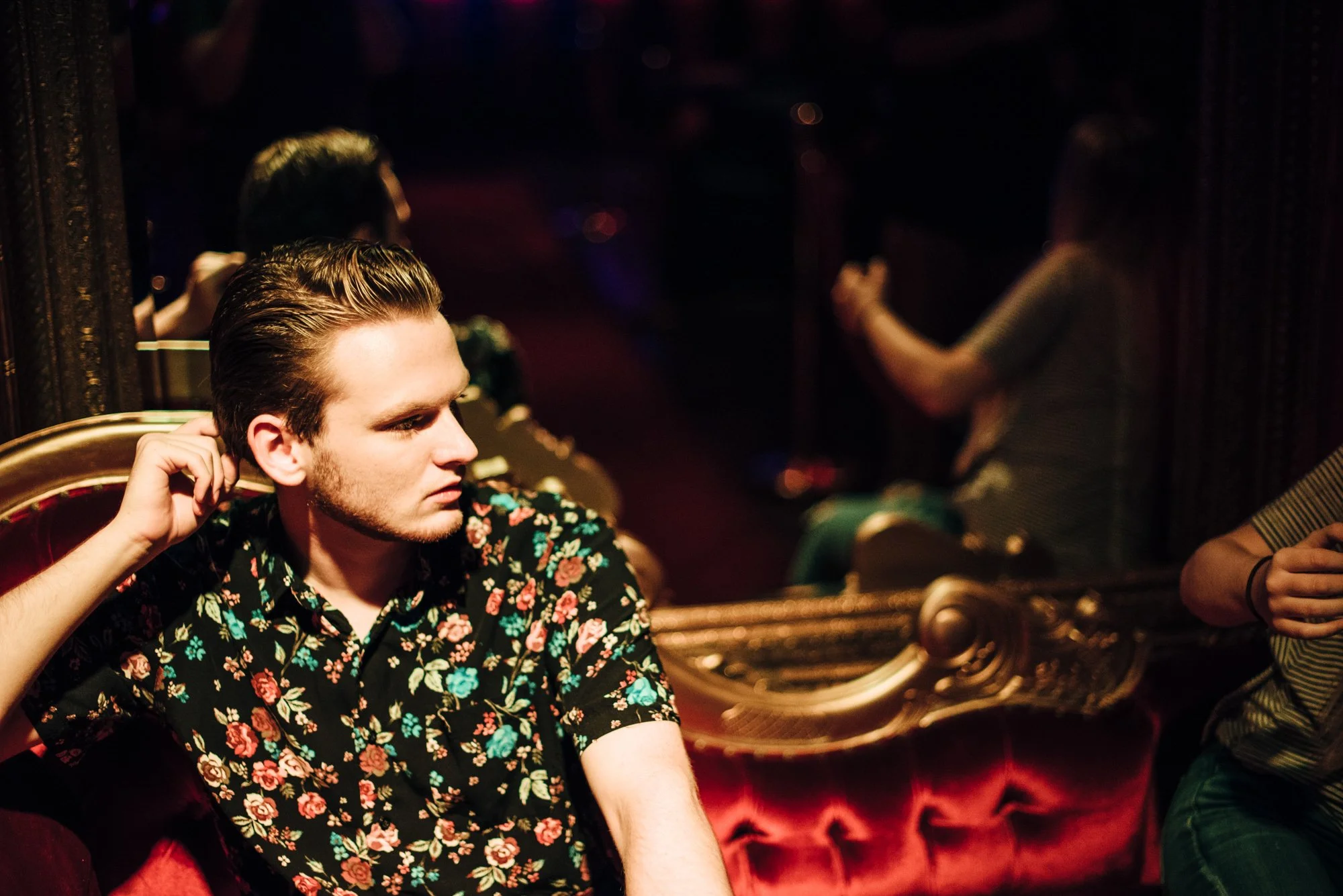BT184-man-on-red-couch-dramatic-lighting.jpg
