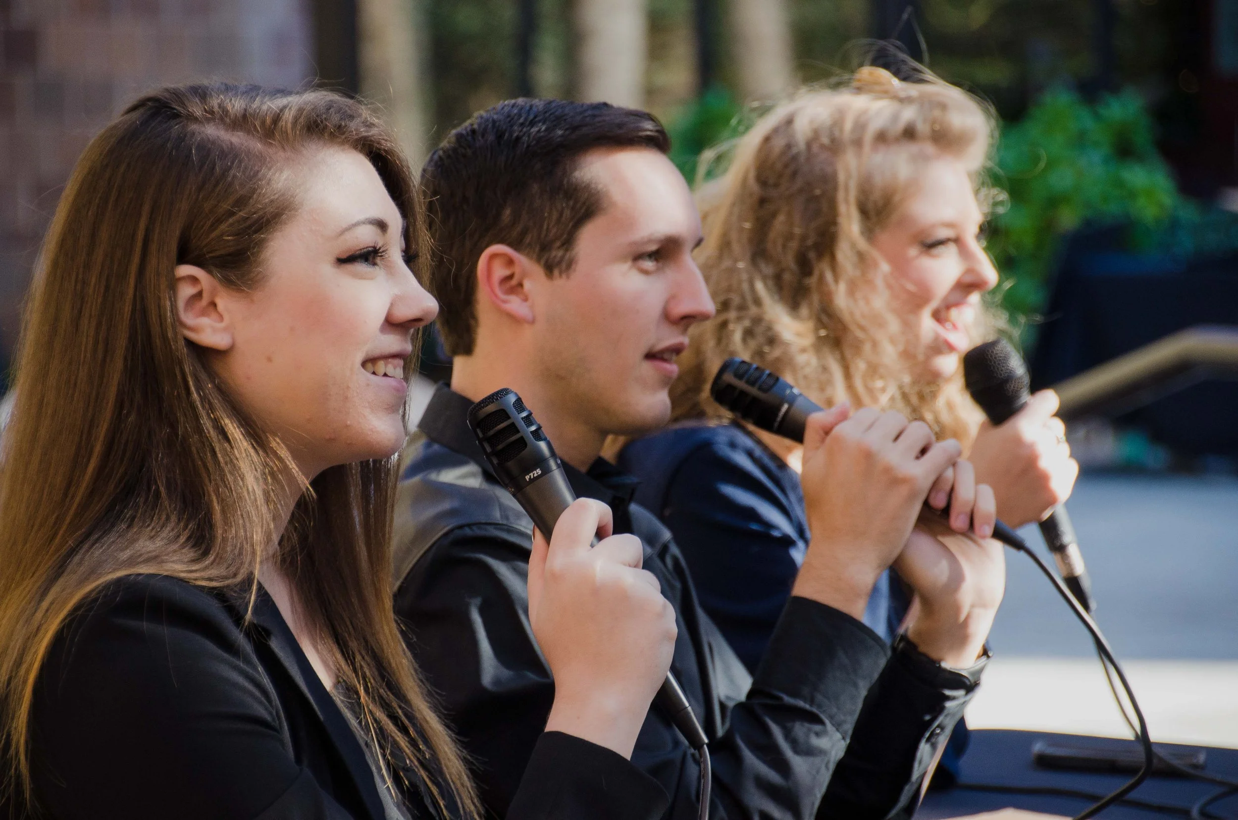 BT11-three-people-lined-up-with-microphones-on-panel.jpg