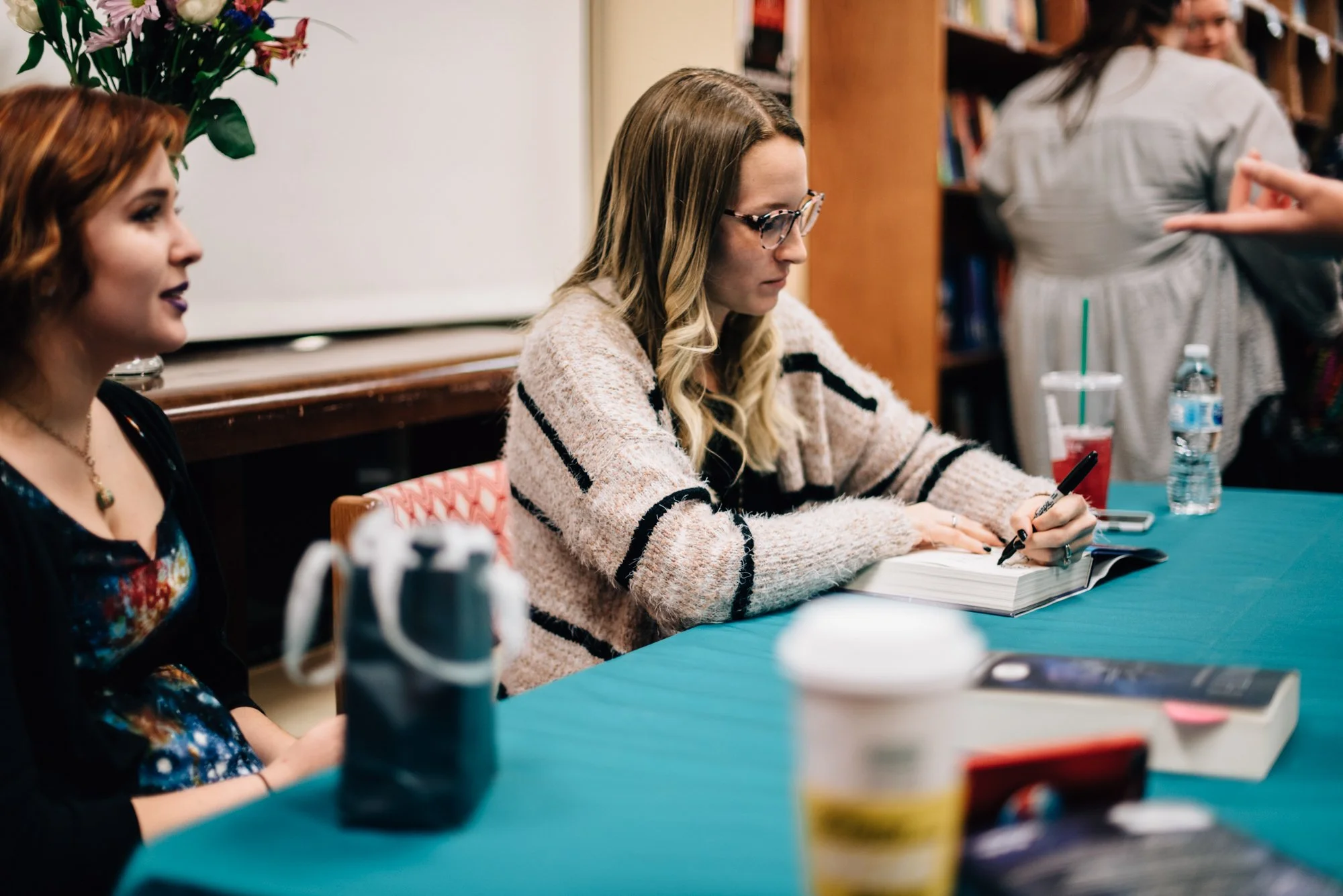 BT24-woman-signing-book.jpg