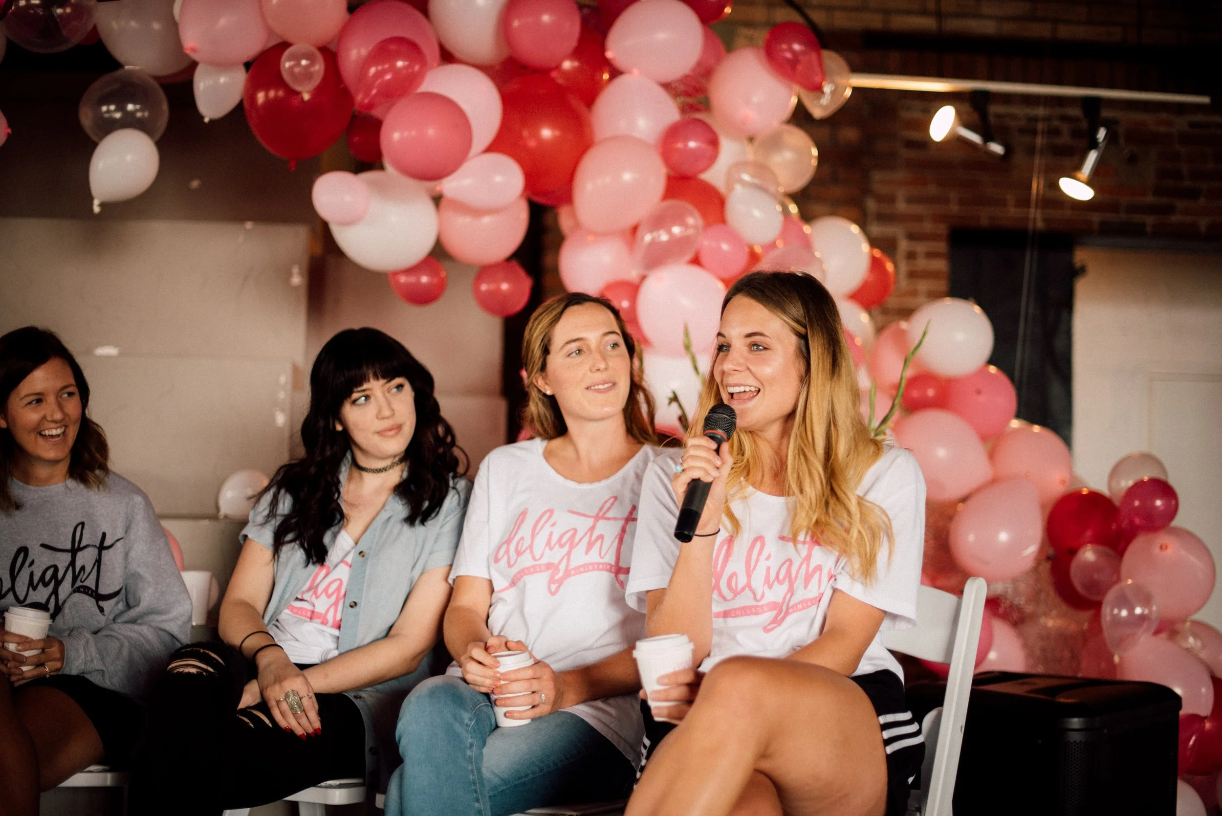 d223-woman-speaking-on-panel-at-conference.jpg