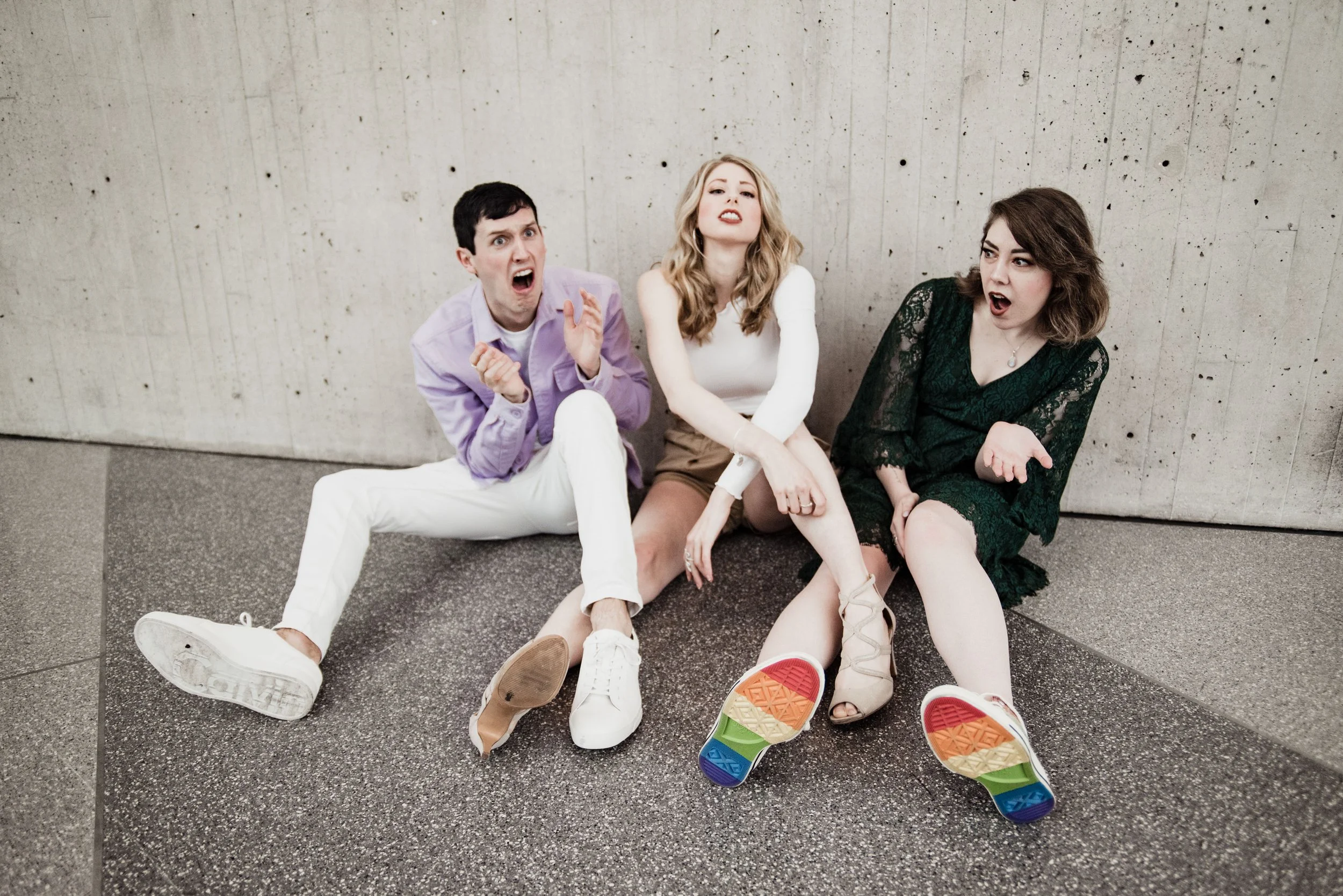 BT295-three-people-on-ground-shocked-faces.jpg