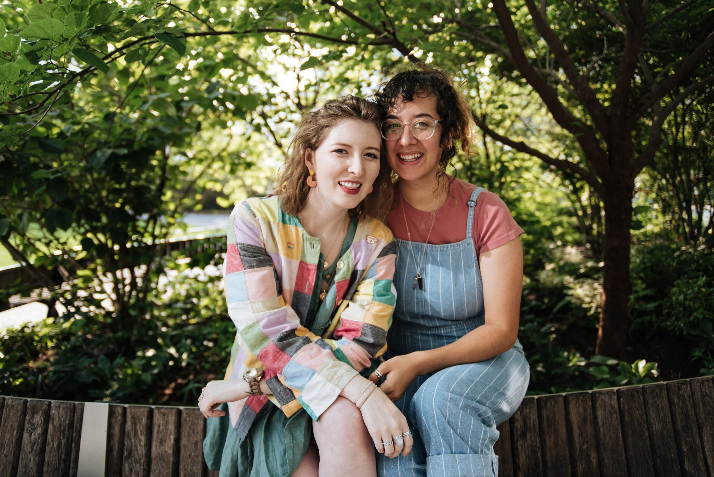 BT397-two-women-smiling-on-bench.jpg