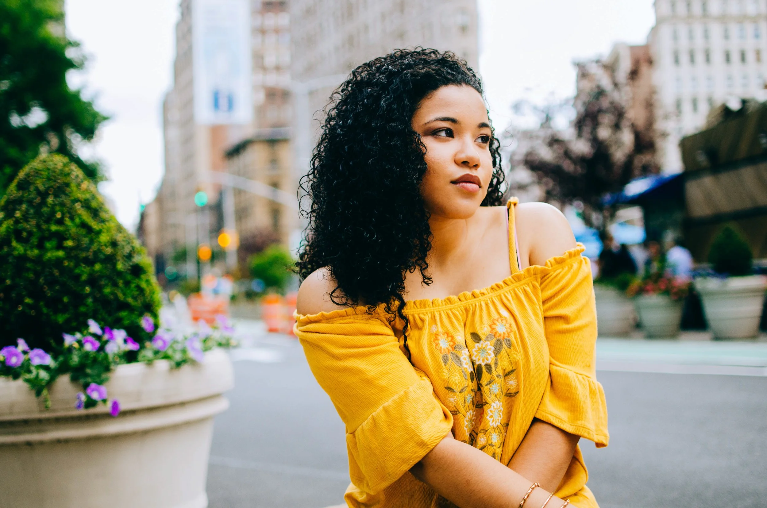 BT172-woman-yellow-shirt-dark-curly-hair.jpg