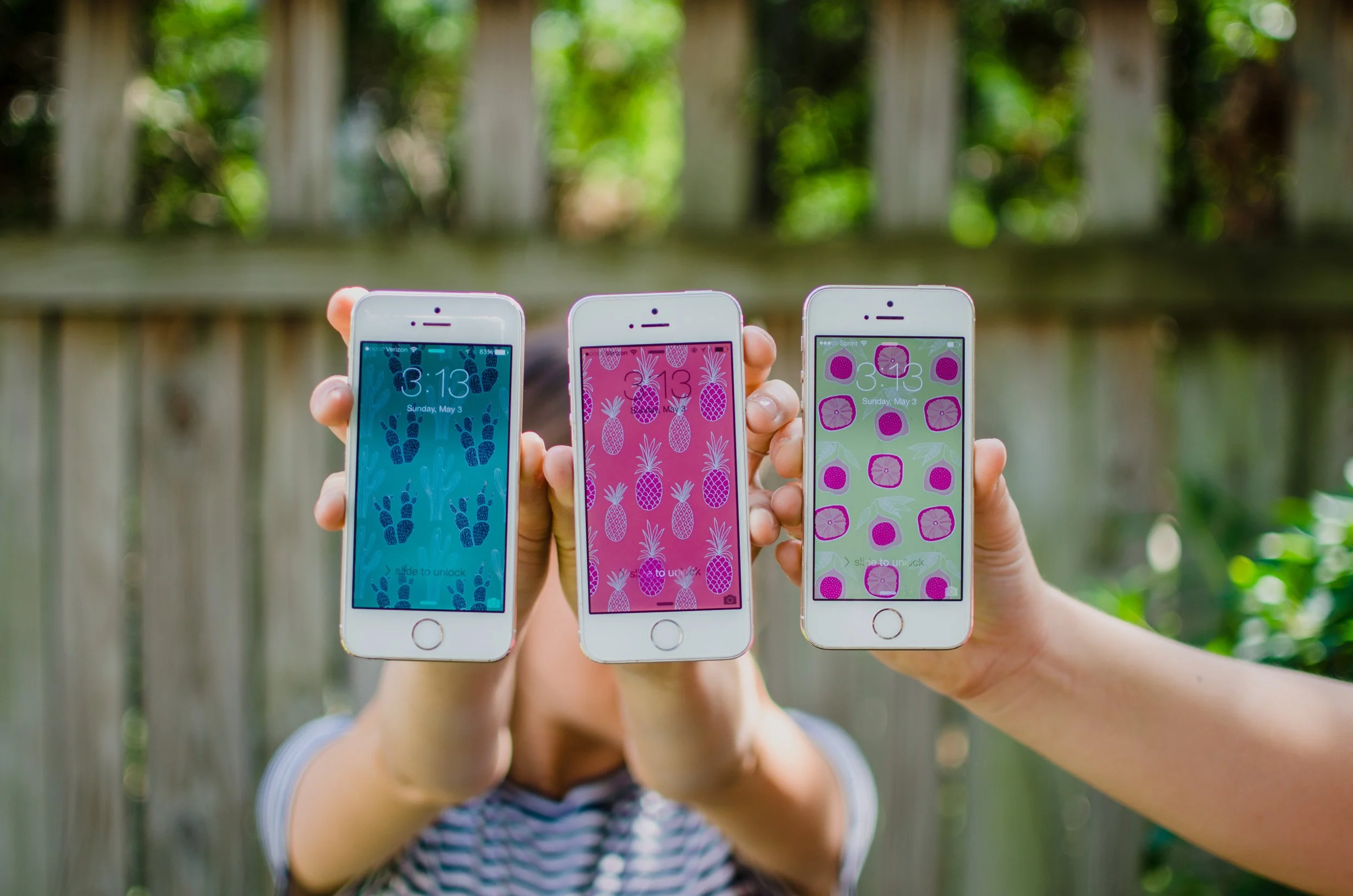 d93-three-iphones-colored-backgrounds.jpg