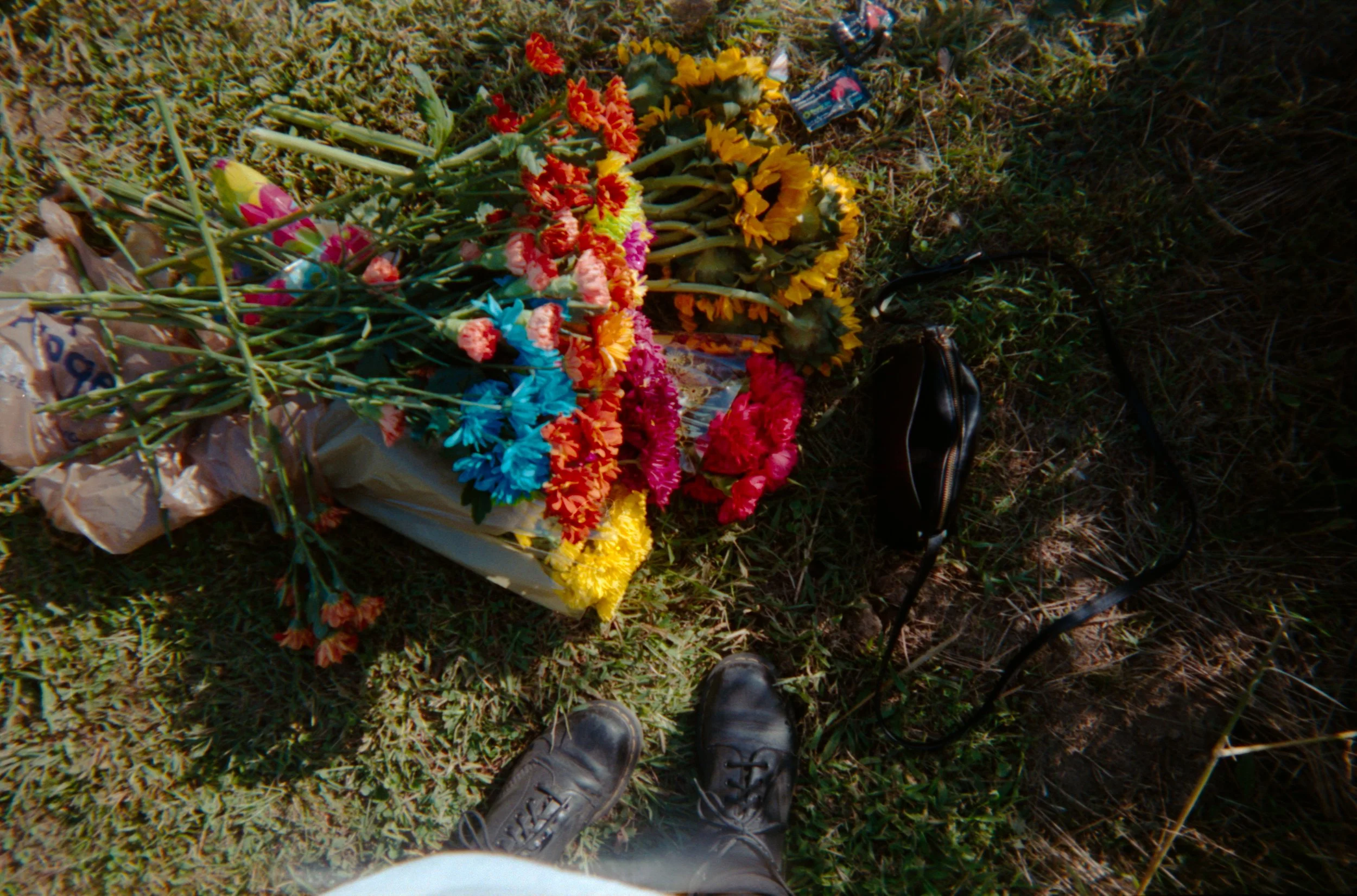 doc-martens-on-grass-with-rainbow-flowers.jpg