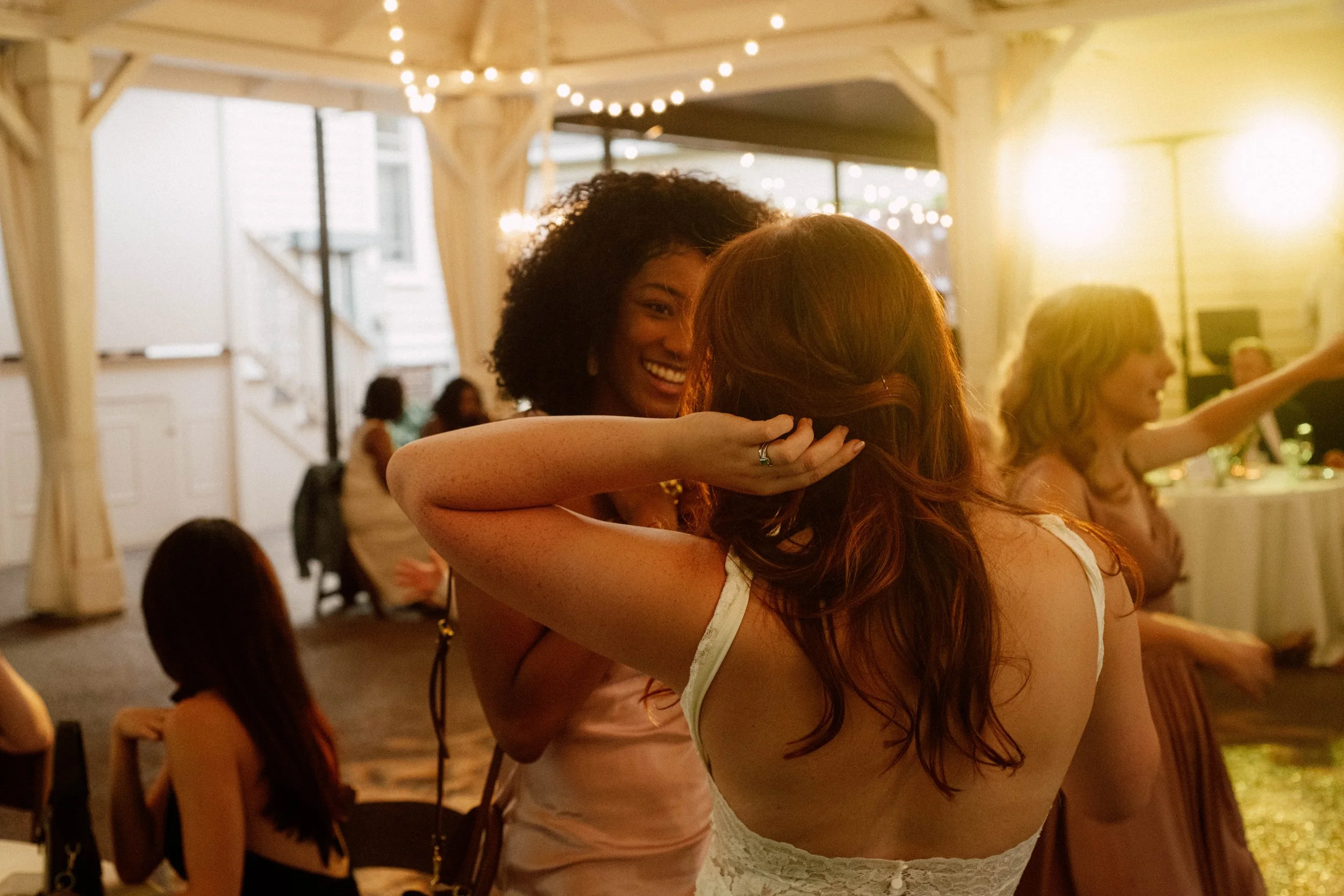 HRD63-bride-fixing-hair-at-wedding-reception.jpg