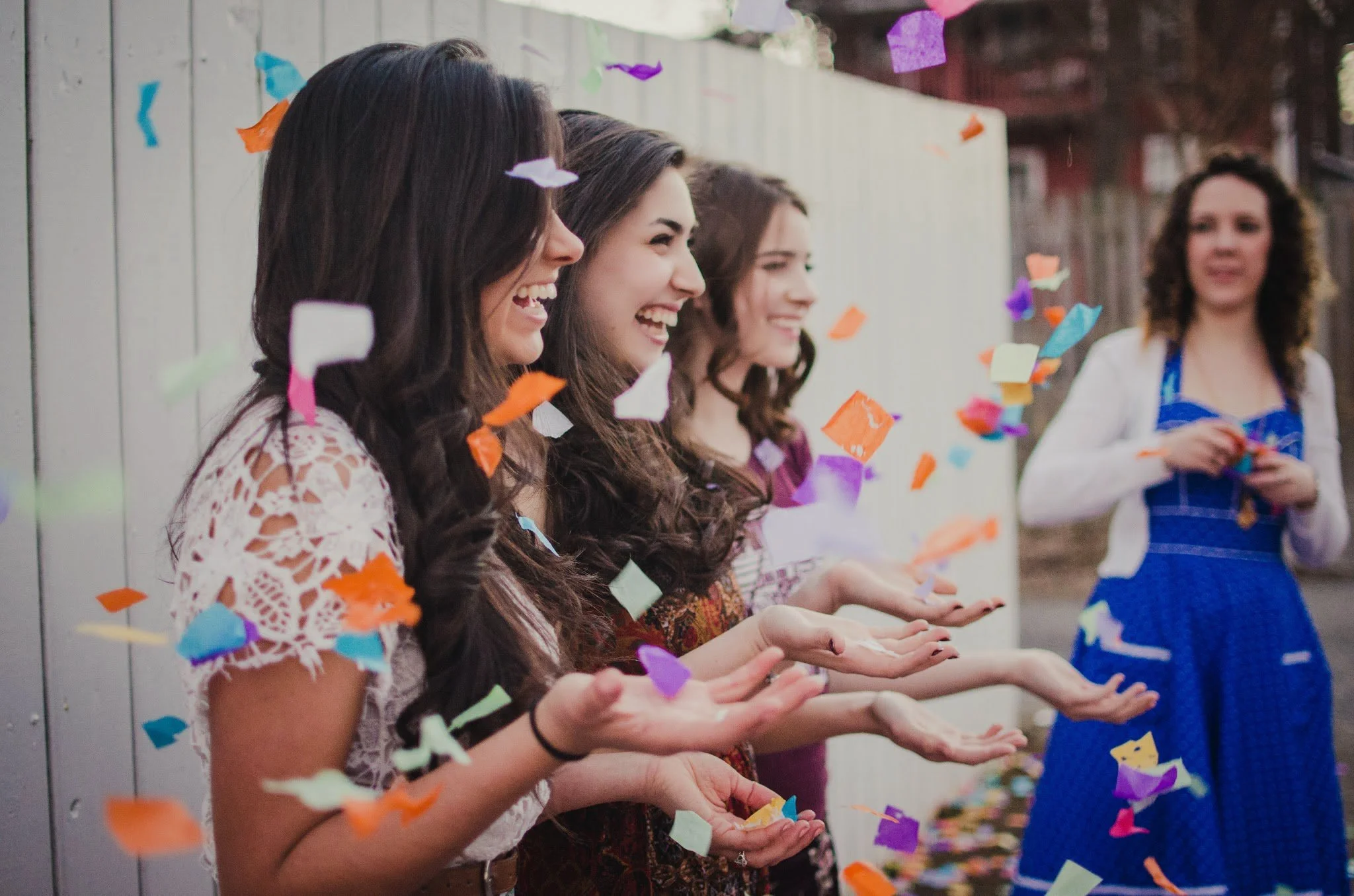d20-women-hands-up-confetti-falling.jpg