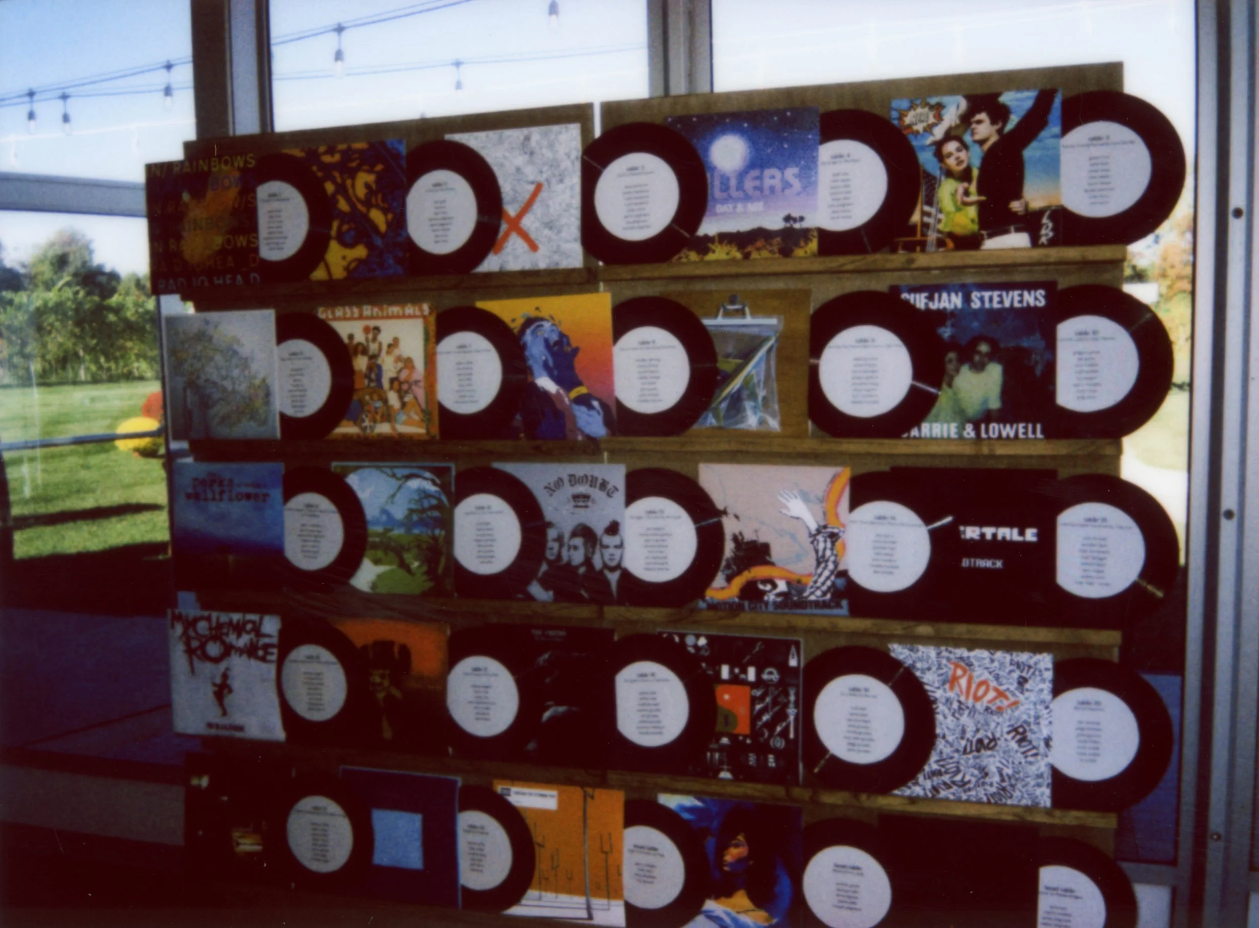 LBW61-wedding-reception-table-assignments-vinyl-records-wall.jpg