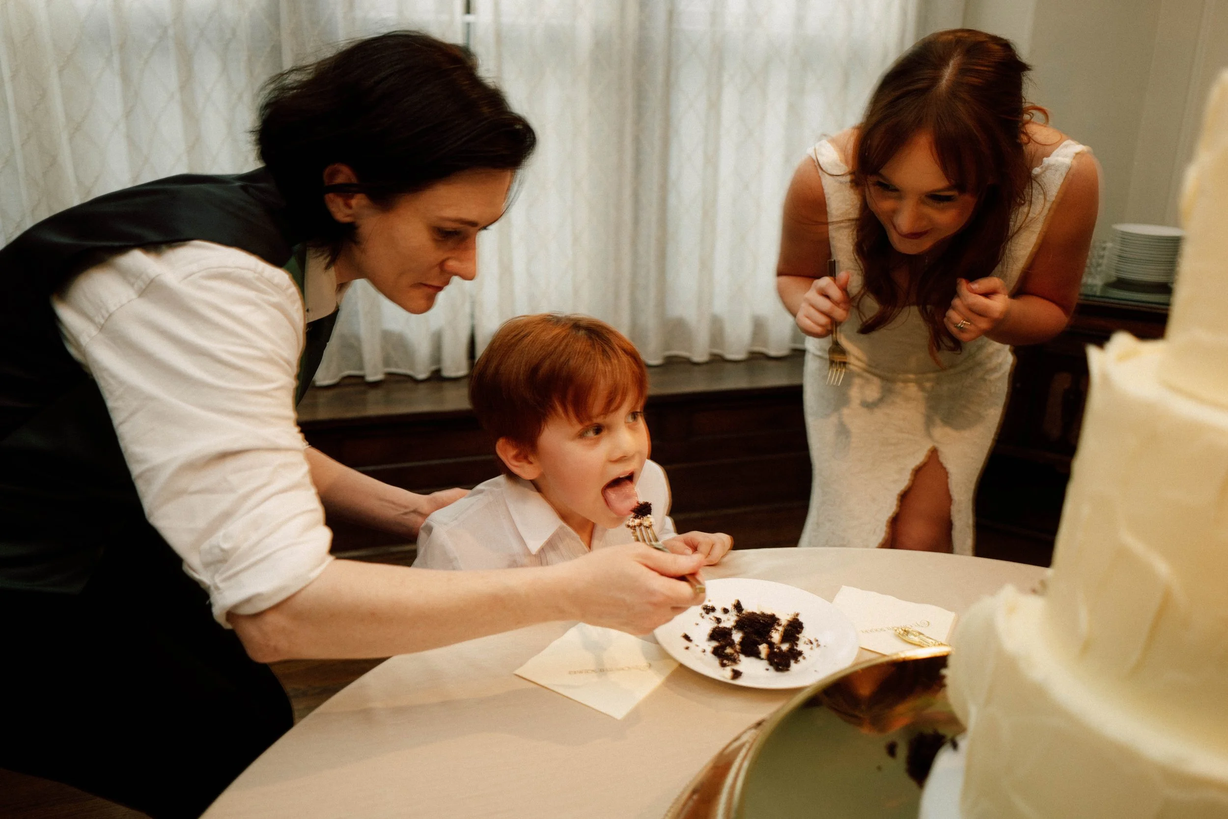 HRD60-lgbtq-brides-feeding-cake-to-child.jpg