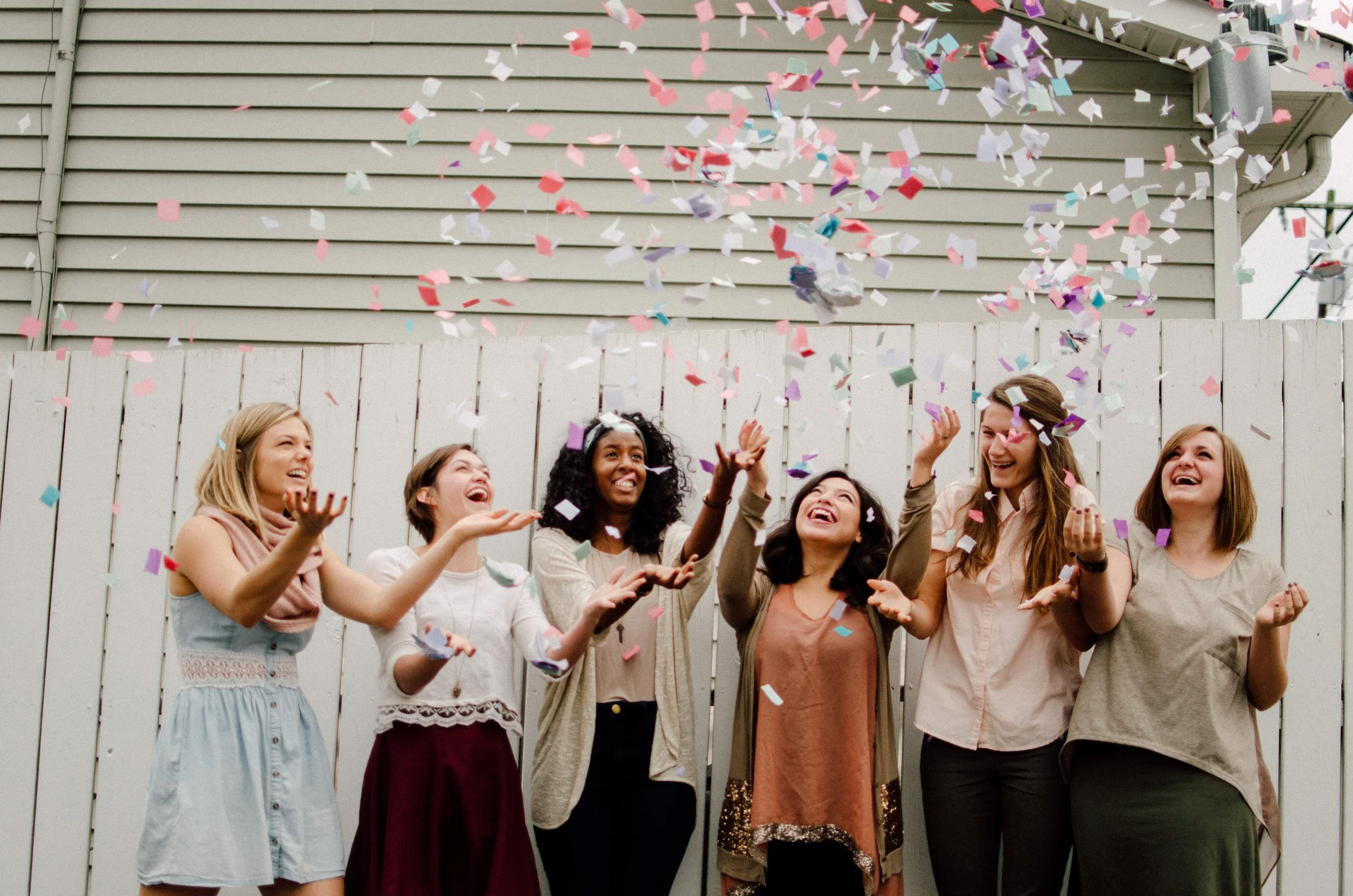 d39-college-girls-tossing-confetti.jpg
