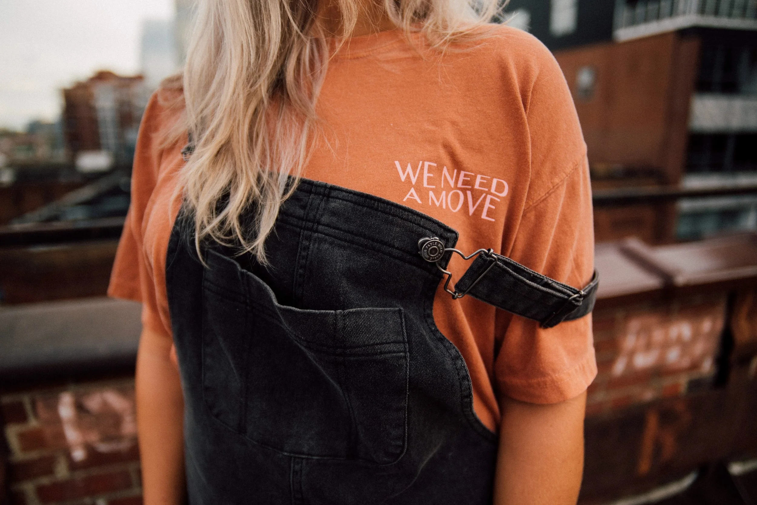 d308-woman-orange-shirt-overalls.jpg