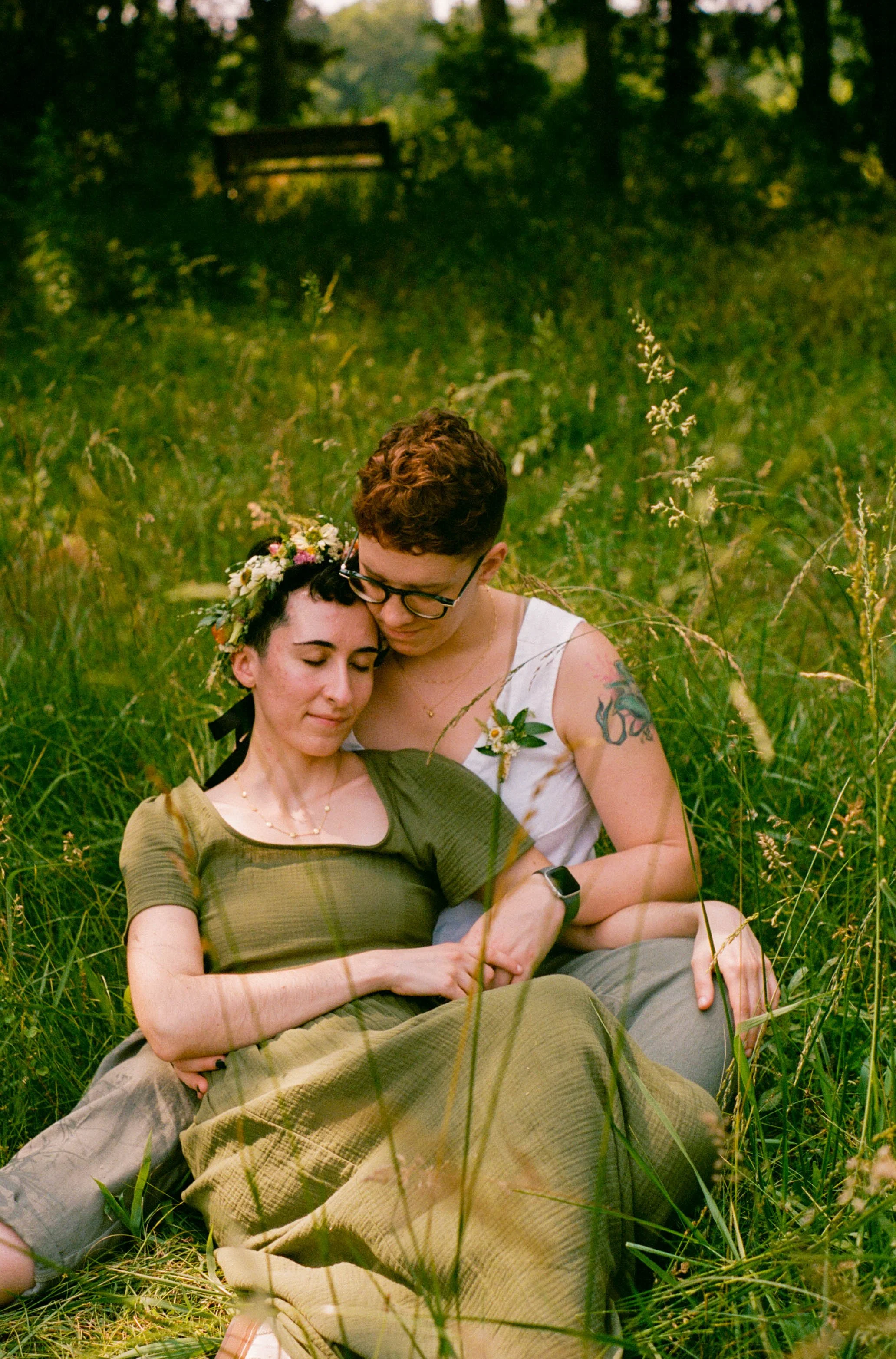 REW20-women-holding-each-other-in-field.jpg