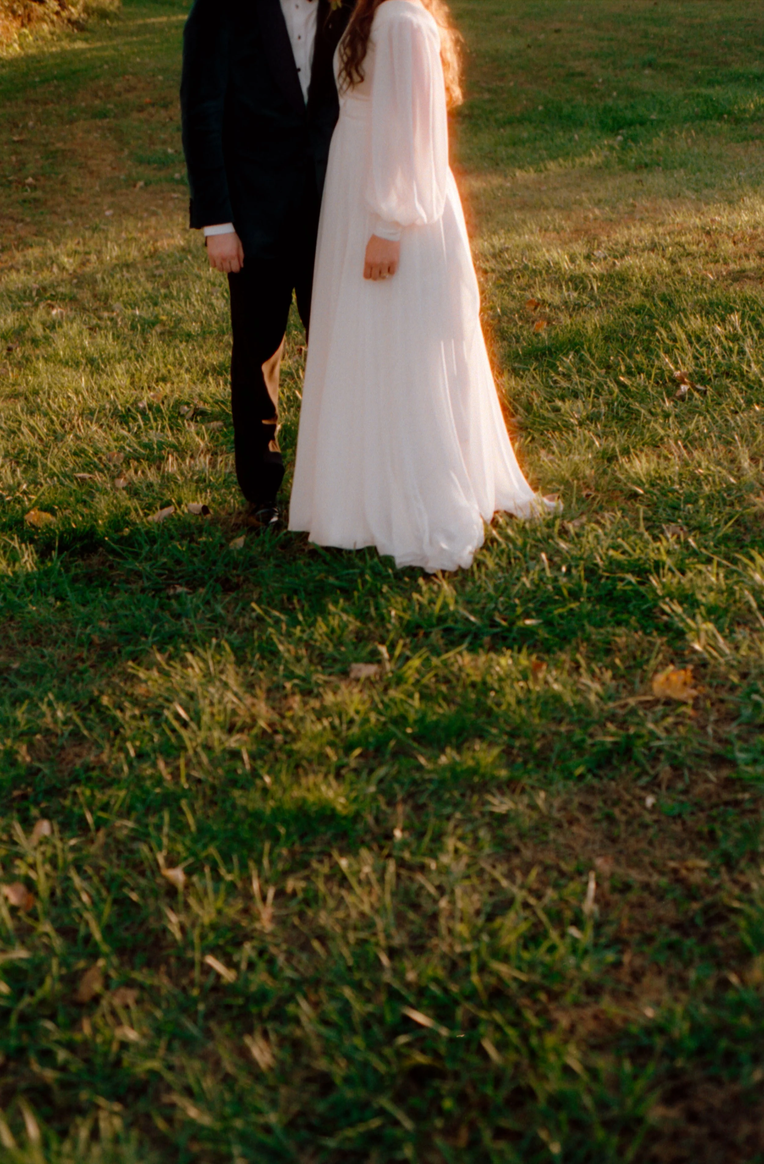 LBW106-bride-groom-standing-on-grass.jpg