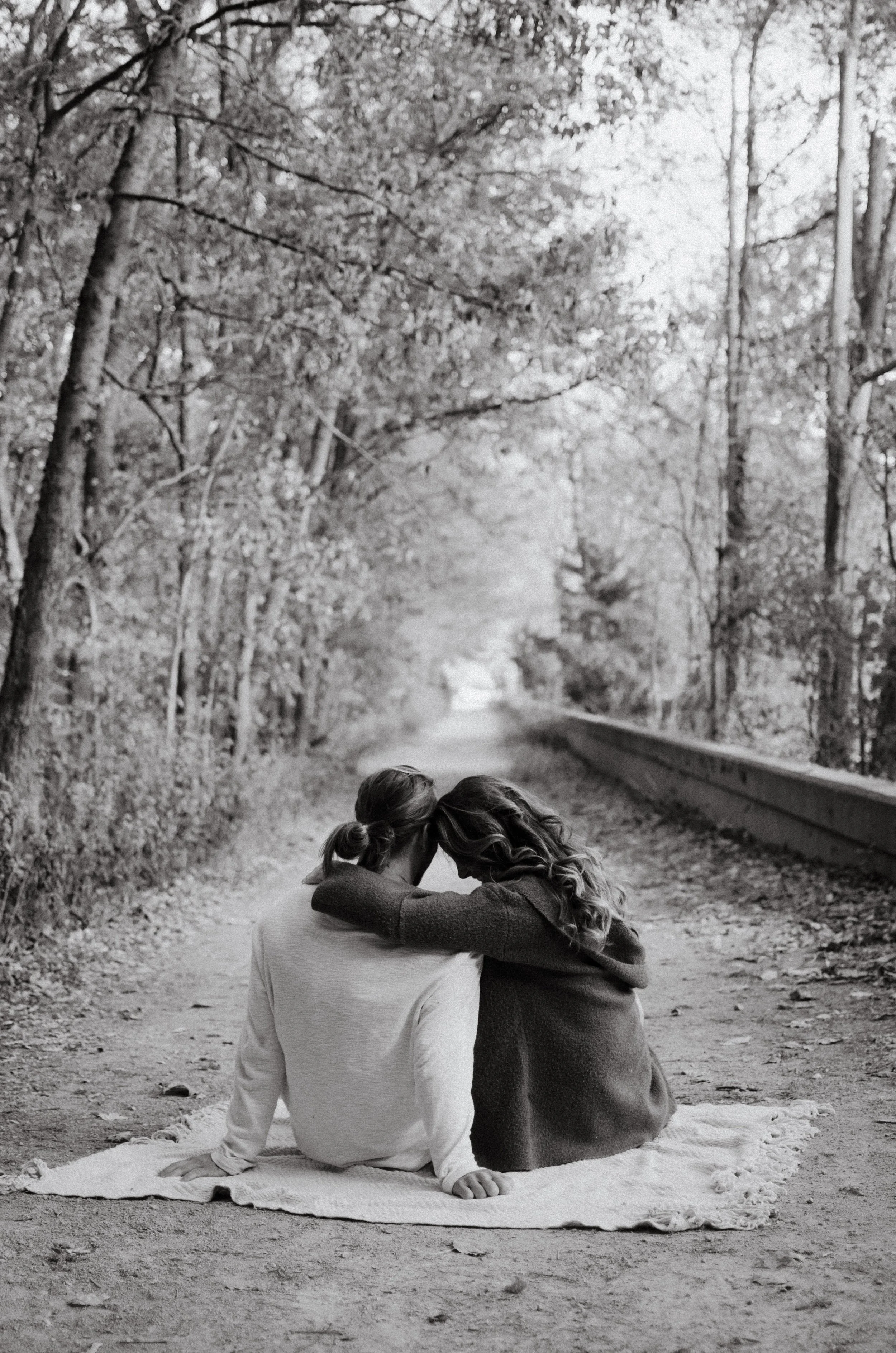d183-man-woman-holding-each-other-on-blanket-nature.jpg