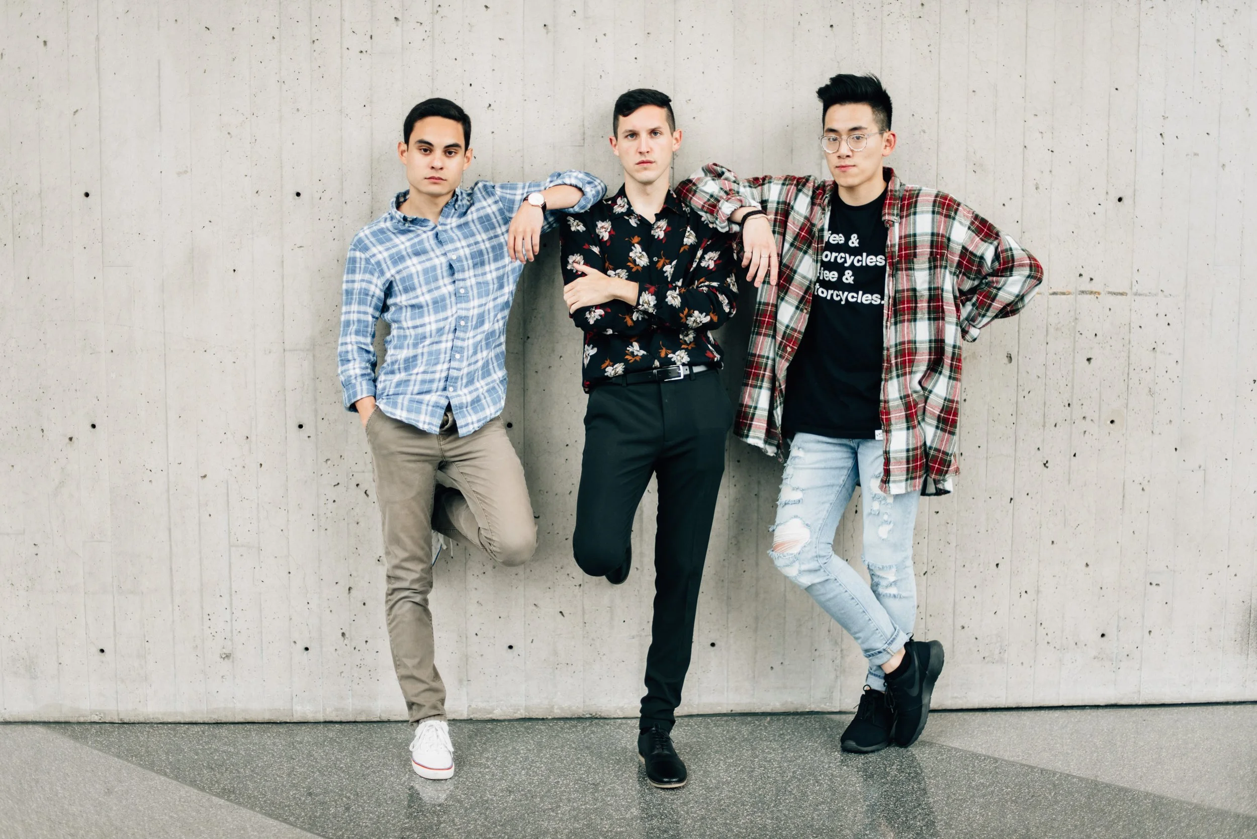 BT96-three-men-leaning-on-wall.jpg