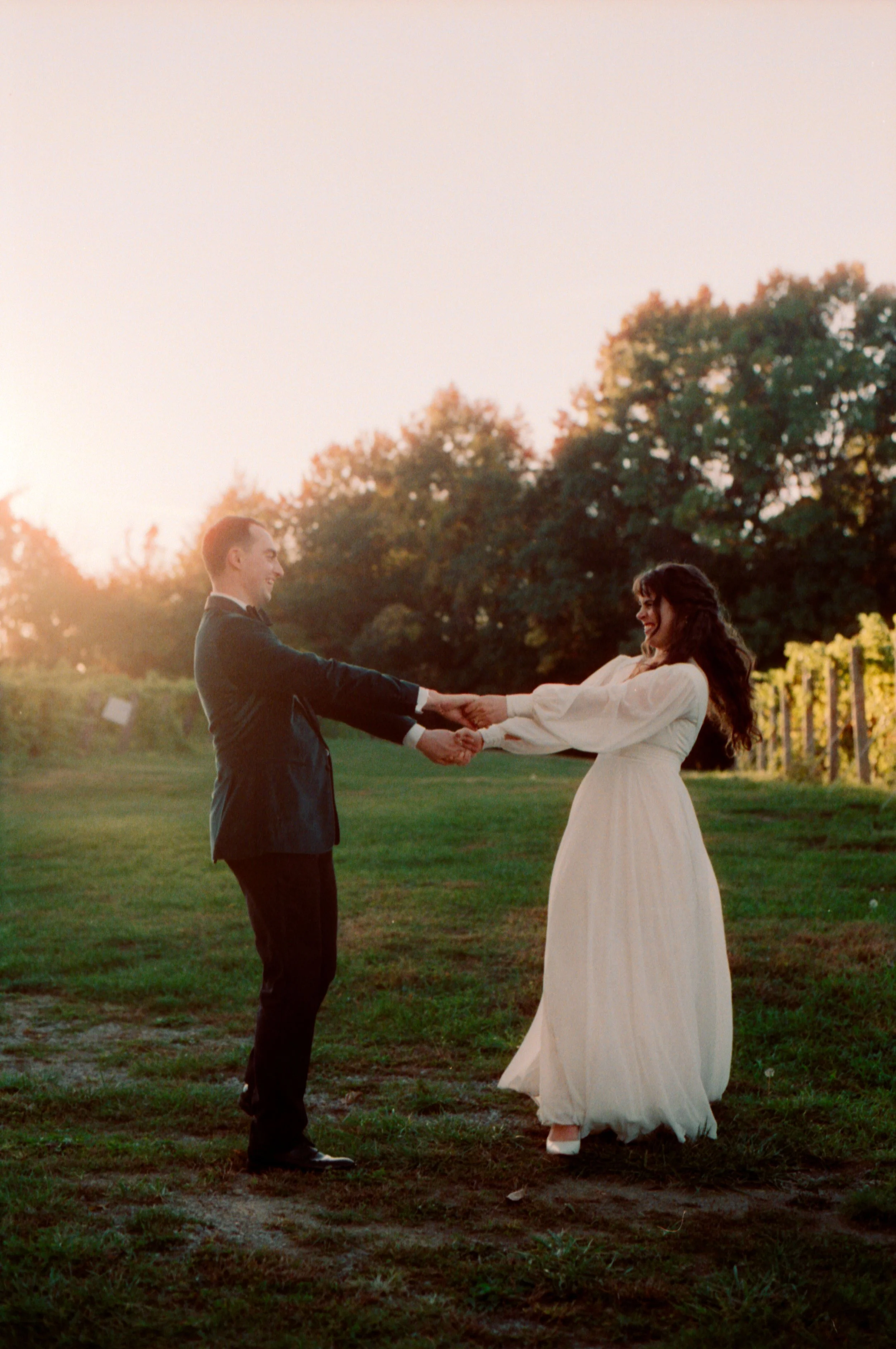 LBW108-bride-groom-spinning-on-grass.jpg