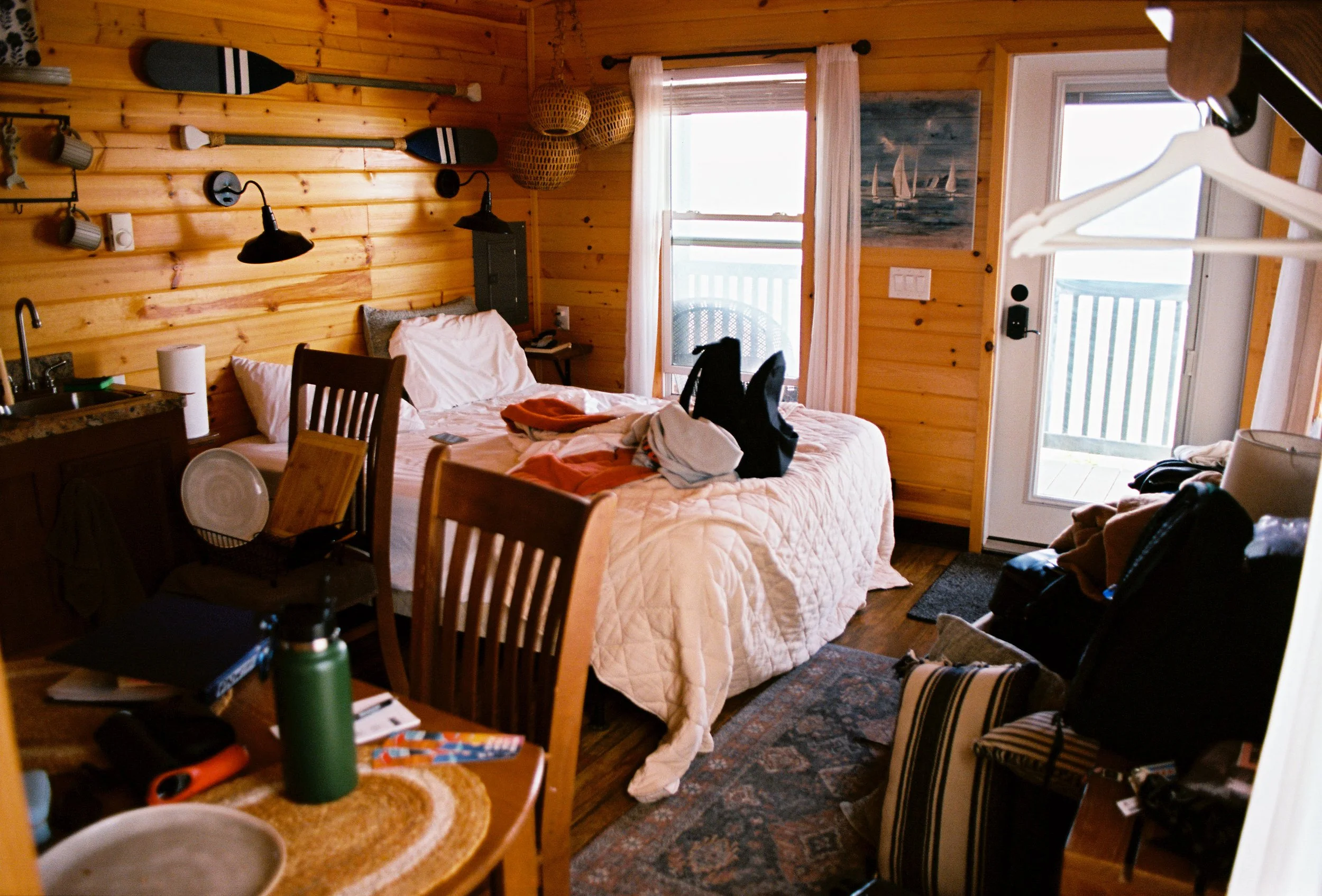 pnw148-messy-cottage-with-bed-wood-walls.jpg