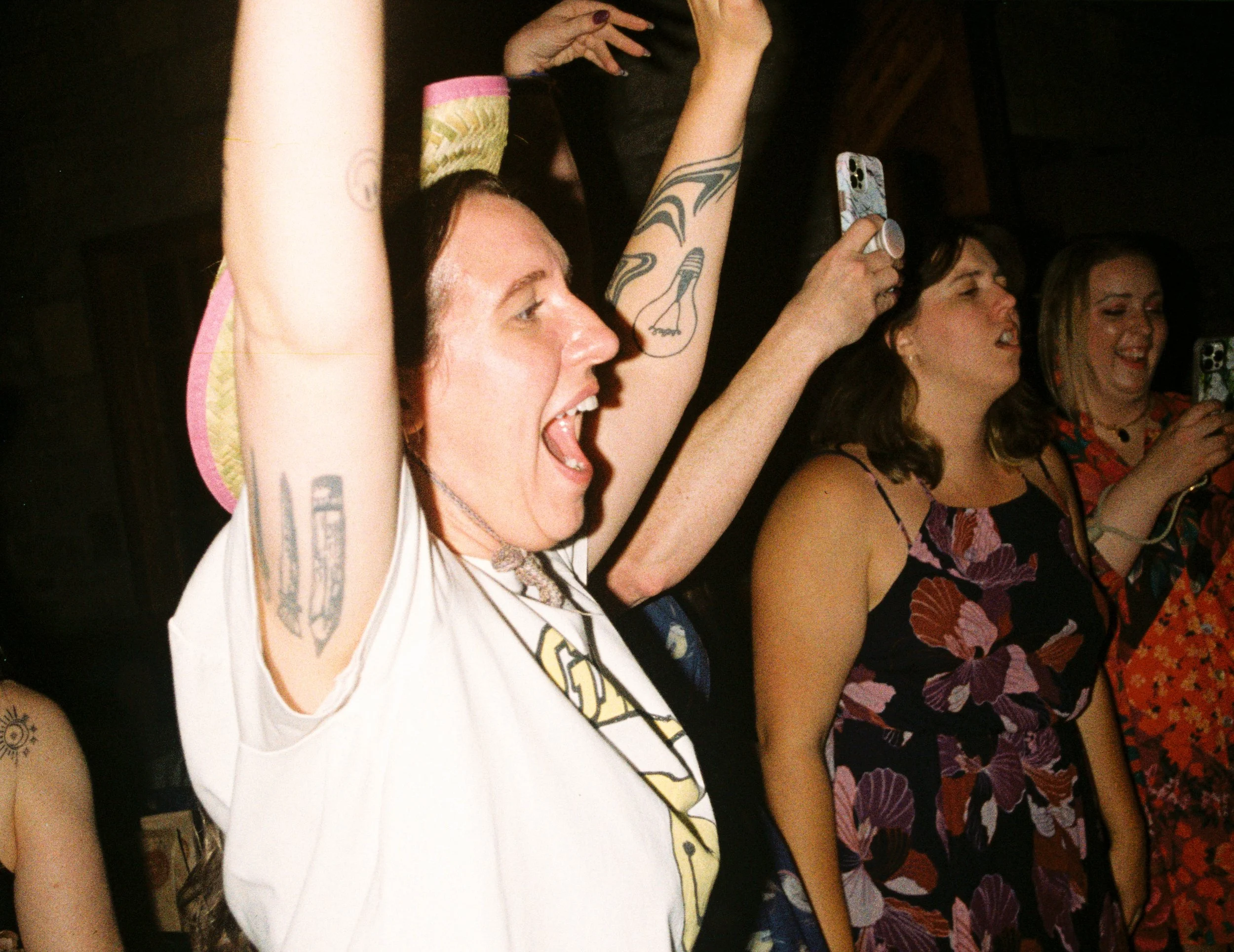 REW94-woman-arms-up-cowboy-hat-flash.jpg