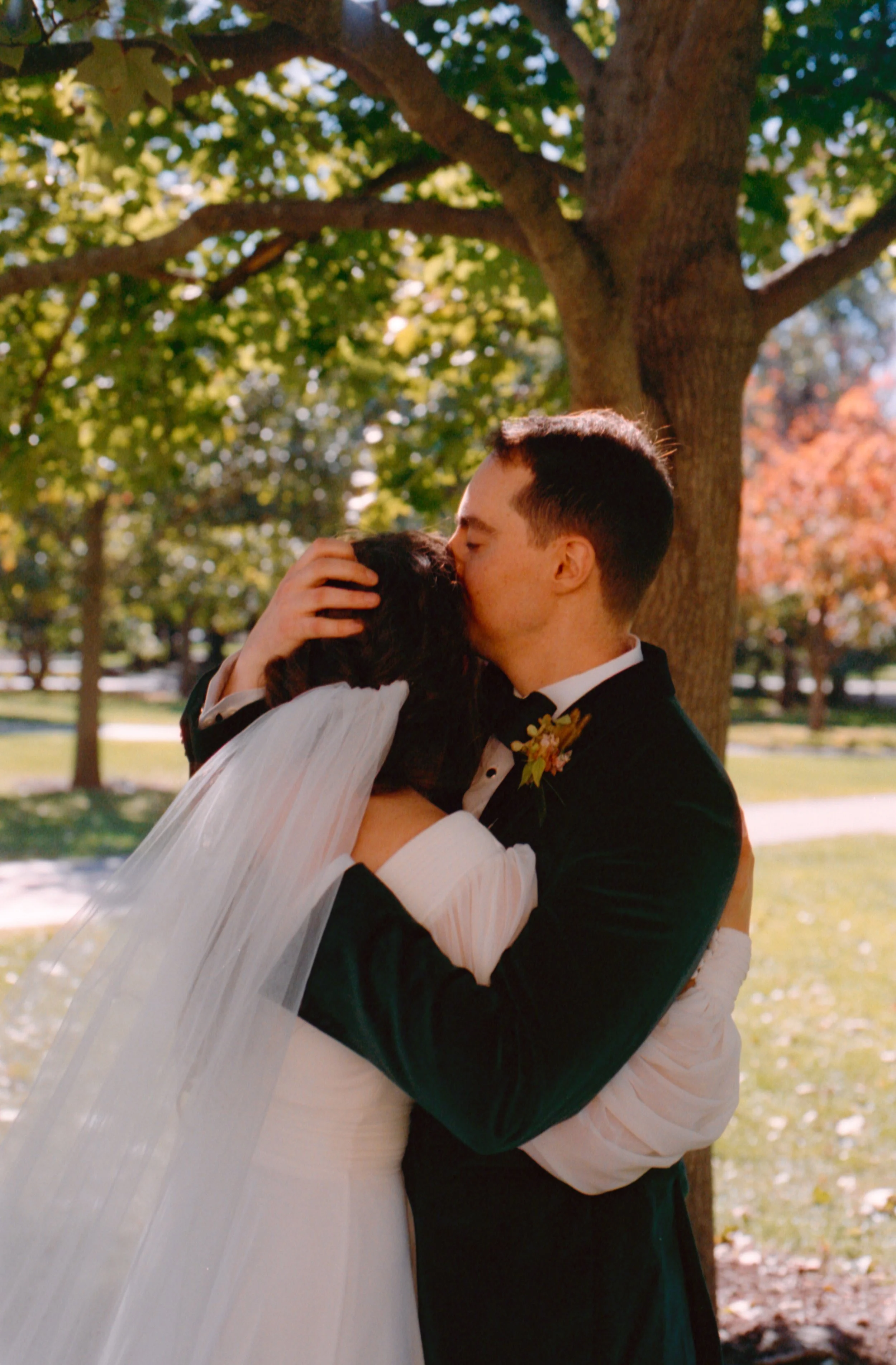 LBW13-groom-holding-bride-under-tree.jpg