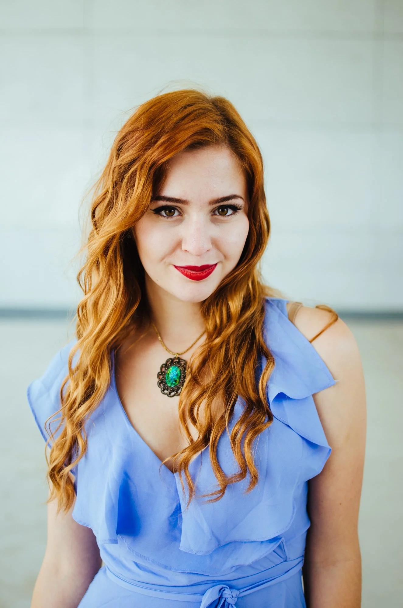 BT42-woman-red-hair-blue-top-necklace.jpg