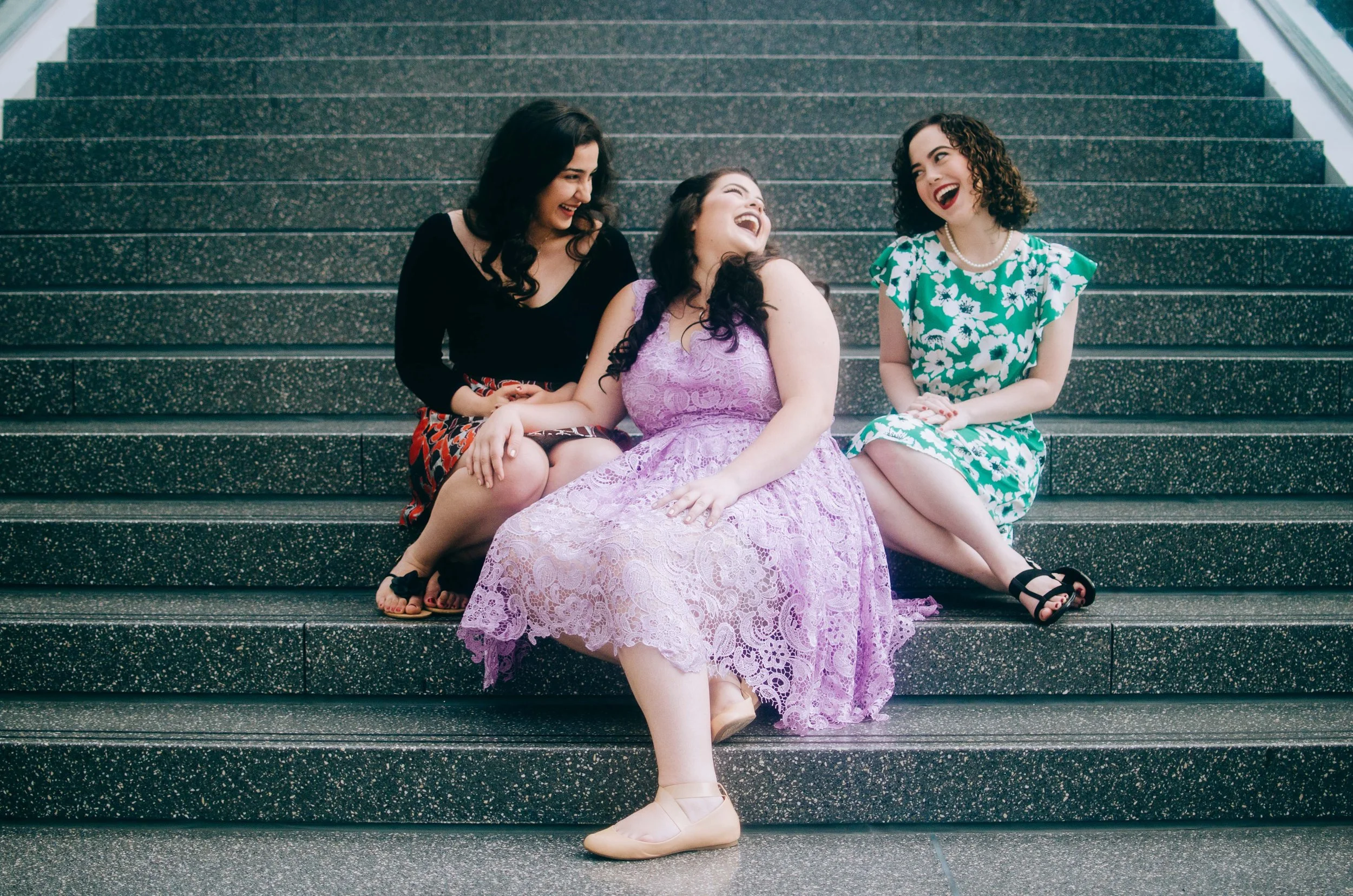 BT202-women-sitting-on-steps-javits-center.jpg