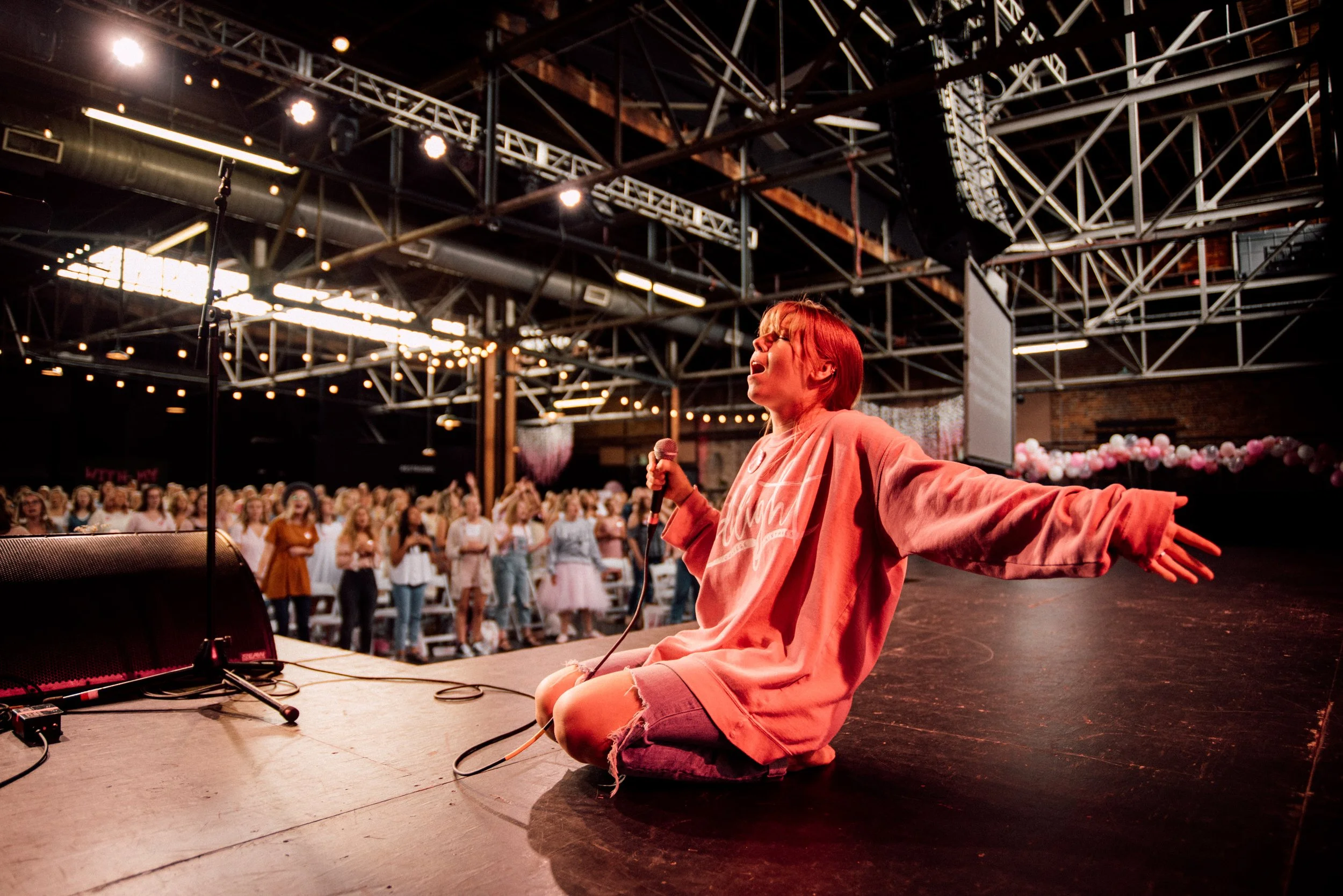 d287-woman-singing-worshipping-on-stage.jpg