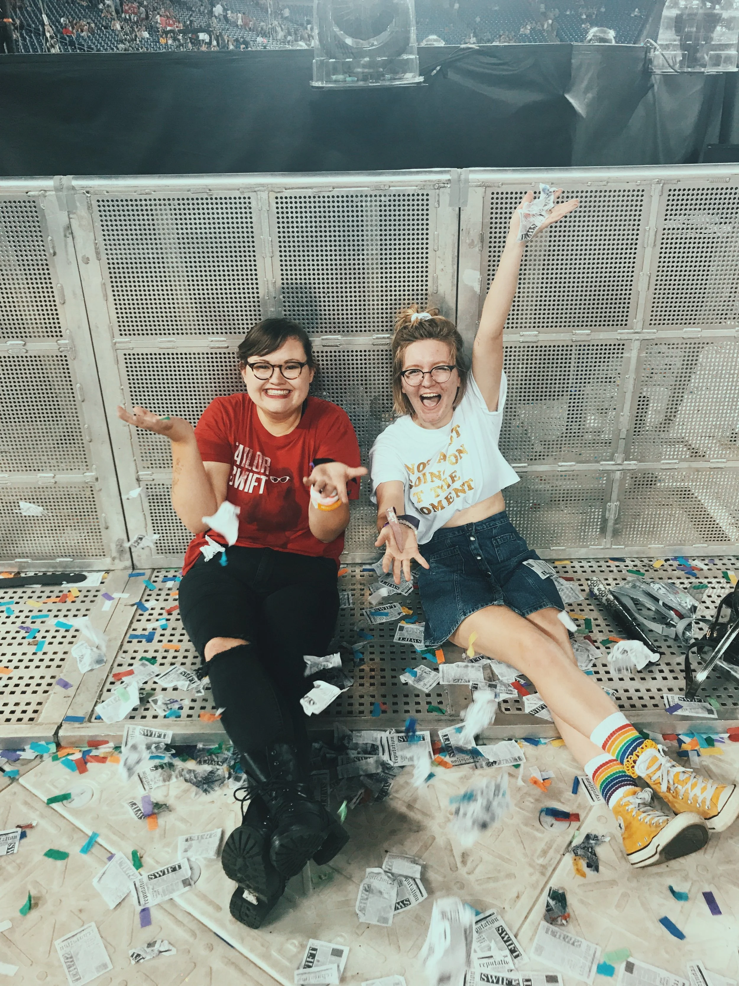 two-women-on-ground-with-confetti-after-concert.jpg